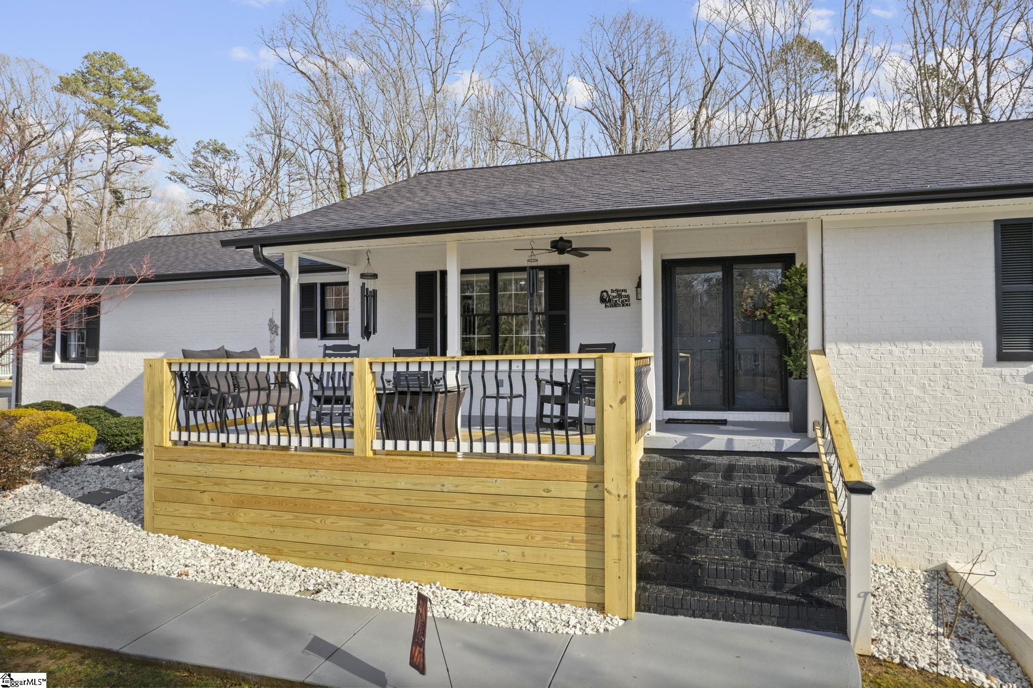 Welcome to a stunning contemporary estate with 5500 sq. ft. estate nestled on 1.50 private acres in the heart of Mauldin, SC. This meticulously designed residence boasts four spacious bedrooms, including two exquisite master suites, each featuring en-suite bathrooms for ultimate privacy and convenience. Each bedroom is thoughtfully designed with generous closet space and large windows that offer picturesque views of the surrounding landscape. A home of this caliber is a rare find in Mauldin Expansive yard – Plenty of space for swing sets, sports, and backyard adventures. With its blend of luxury, privacy, and modern convenience, 3 Kingsley Court offers an unparalleled living experience. Indulge in the grandeur of estate living while being just moments from premier shopping, dining, and top-rated schools. Designed for both luxury and functionality, the property features three expansive decks, perfect for outdoor gatherings or simply enjoying the serene surroundings. A screened-in porch adding an additional layer of comfort, allowing you to savor the outdoors while being sheltered from the elements. The grand living spaces provide an inspiring backdrop for hosting clients, celebrating milestones, or simply unwinding after a long day. As you enter, you’re greeted by an expansive living area that seamlessly connects to a gourmet kitchen, complete with state-of-the-art appliances, a large island, and ample storage. This stunning covered pool area is designed for ultimate relaxation and enjoyment, featuring a dedicated bathroom that ensures privacy and convenience. Whether you’re hosting a summer gathering or enjoying a quiet evening swim, this space offers luxurious comfort year-round, making it an ideal retreat for both entertaining and unwinding Security is paramount in this residence, featuring a comprehensive security system with 16 strategically placed cameras and door cameras for all six entrances, providing peace of mind and safety for you and your loved ones. With its blend of cutting-edge amenities, spacious living areas, and an expansive outdoor setting, this home is a true sanctuary that offers both modern luxury and a connection to nature. Experience the ultimate in contemporary living with every thoughtful detail designed for your comfort and security. A fully fenced estate, and two private workshops a, this property allows you to entertain, build, and innovate—all in one location. Nestled in a prime Mauldin location, this estate provides quick access to Greenville’s business hubs, premier dining, elite training facilities, all while maintaining complete seclusion.