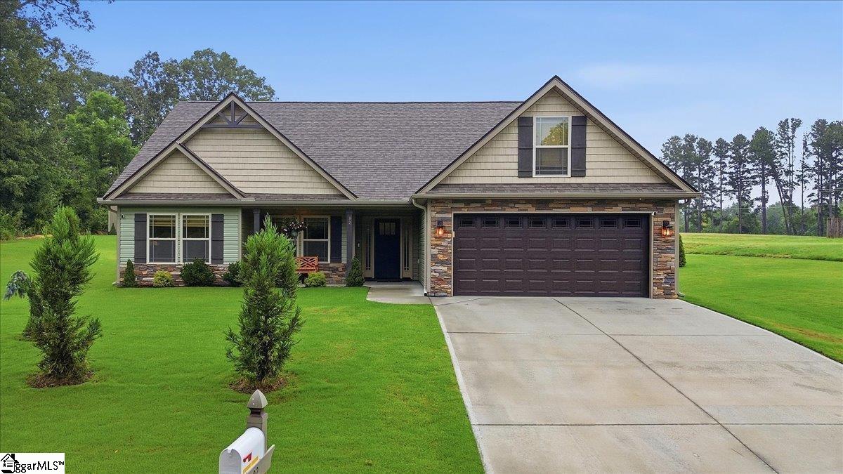 Like new and impeccably maintained, this beautiful 4-bedroom home sits on a private, peaceful 1-acre homesite offering the perfect blend of comfort and country living. No HOA! From the moment you arrive, you'll appreciate the manicured landscaping, exceptional curb appeal, and meticulous attention to detail throughout.  Inside, the open-concept floor plan features luxury vinyl plank flooring, granite countertops, and upgraded Craftsman-style interior trim that creates a timeless, custom feel. The spacious kitchen flows seamlessly into the living and dining areas, making it ideal for both everyday living and entertaining. Custom Roman shades add style and function throughout the home.  The generously sized primary suite and three additional bedrooms provide flexibility for family, guests, or a home office.  Step outside to enjoy the quiet surroundings, expansive yard, and the privacy that only a country setting can offer. A storage building provides additional space for tools and equipment.  Refrigerator, washer, and dryer all convey, making this home truly move-in ready. The sellers are also including numerous additional items, including a lawn mower, outdoor furniture, and other accessories—an exceptional value that allows you to start enjoying your new home from day one.  If you're looking for a home that shows like new, offers quality finishes, and provides peace, privacy, and convenience, this is one you won't want to miss.
