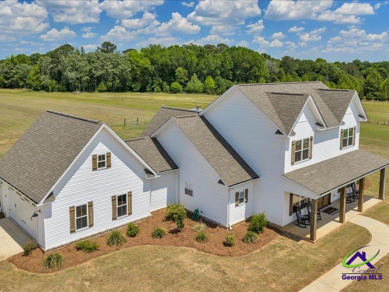 Country living at its finest.This is what you've been looking for. (Click virtual tour)Just minutes from I-75 and Perry but a World away!No HOA. Address is Elko but Henderson is more accurate.  This home is a true oasis; You have plenty of room for family and guests, a Beautiful pool, even an area for animals fenced off with a small pond. The house is immaculate. Great detail went into the design and flow of this home. The kitchen is a chef's dream. It even includes a butler's pantry. The primary suite is downstairs as well as an in law suite. Upstairs, there are two more bedrooms connected via a unique jack and jill bathroom that allows each to have private areas for getting ready.Attic has ample storage capacity. Can we mention the Gorgeous blue pool with diving board, serviced by a large covered patio with fireplace and tv hookup, and access to a half bath right from the deck??  This access leads conveniently into the laundry room and then mud room. You might never leave the property, but if you did, you will find a vibrant community awaiting just minutes away. Trust me, this is where the future is for Houston County. Come see for yourself.  We have a parcel listed next door that is 8.97 acres if you want even more room to spread out or create your own Family Estate. Please view our video on Youtube. Just search 240 Williams Circle Elko Ga