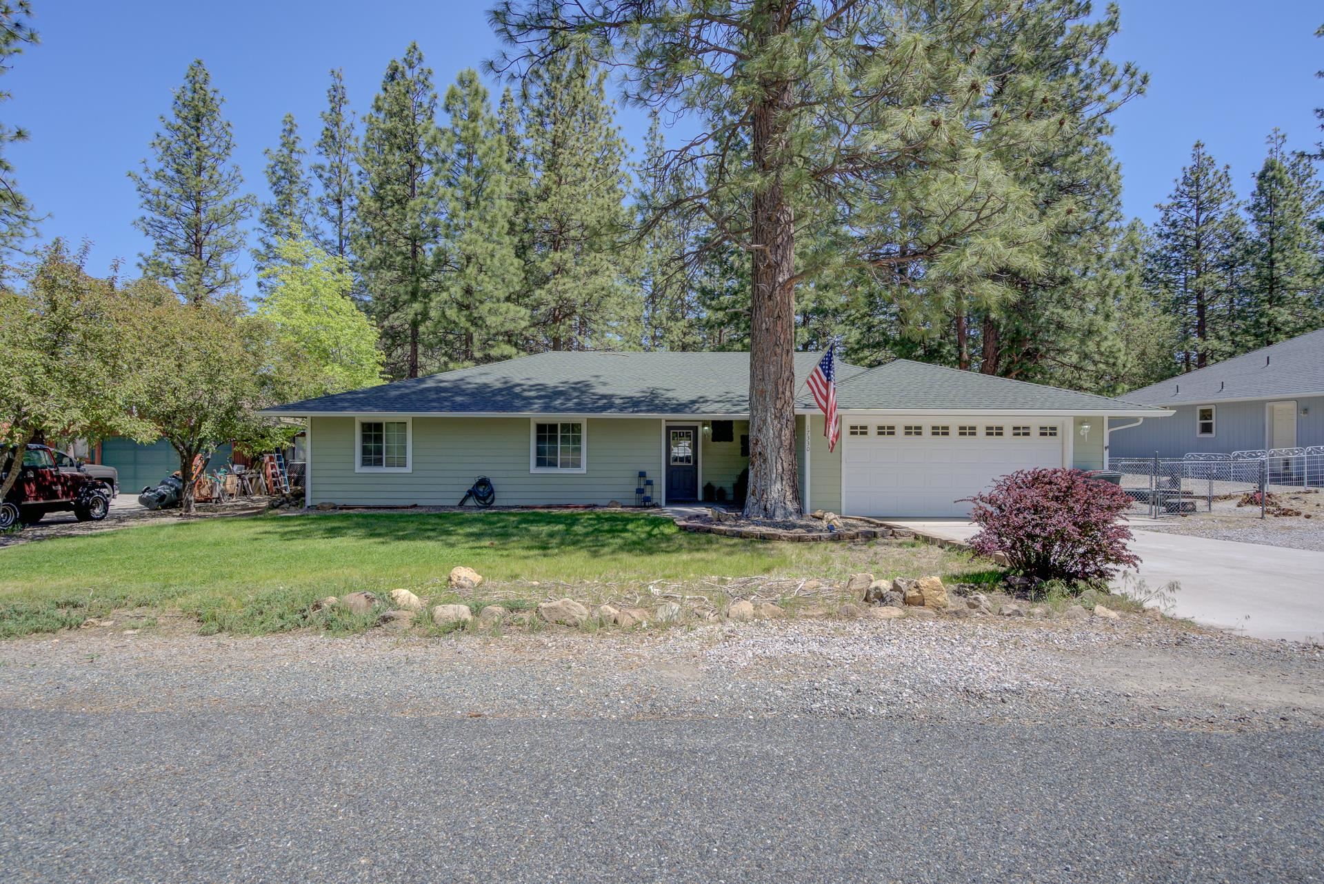 Welcome to 17330 Gilbert Ct, a peaceful 3-bedroom, 2-bathroom home offering 1,393 sq ft of comfortable single-level living in the wonderful Lake Shastina community. Built in 2001 and situated on a 0.23-acre lot, this home features a spacious and functional layout with generous living areas that flow seamlessly to the outdoors. Step outside to a blissful backyard retreat complete with a patio, horseshoe pit, and garden space, perfect for relaxing evenings, entertaining guests, or enjoying the fresh mountain air. An attached garage provides convenient parking and additional storage. Tucked away on a quiet cul-de-sac beneath the pines, this property offers a serene setting while still being just minutes from Lake Shastina’s golf course, dining, recreation, and year-round outdoor adventure. Experience the perfect balance of comfort, amenities, nature, and rural mountain living at 17330 Gilbert Ct.