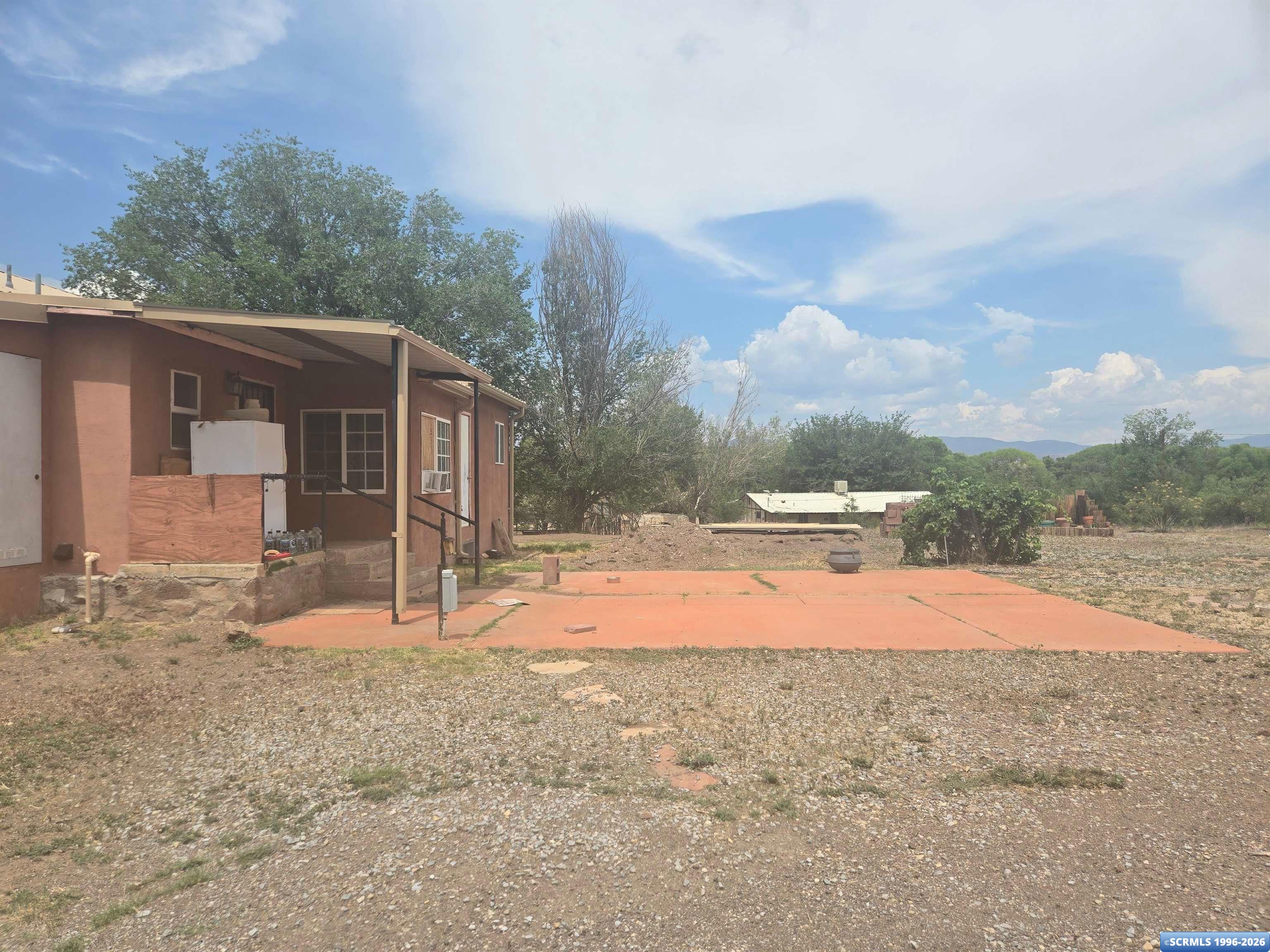 Beautiful 9-acre property featuring a charming 3-bedroom, 2-bath home with plenty of space to enjoy country living. 