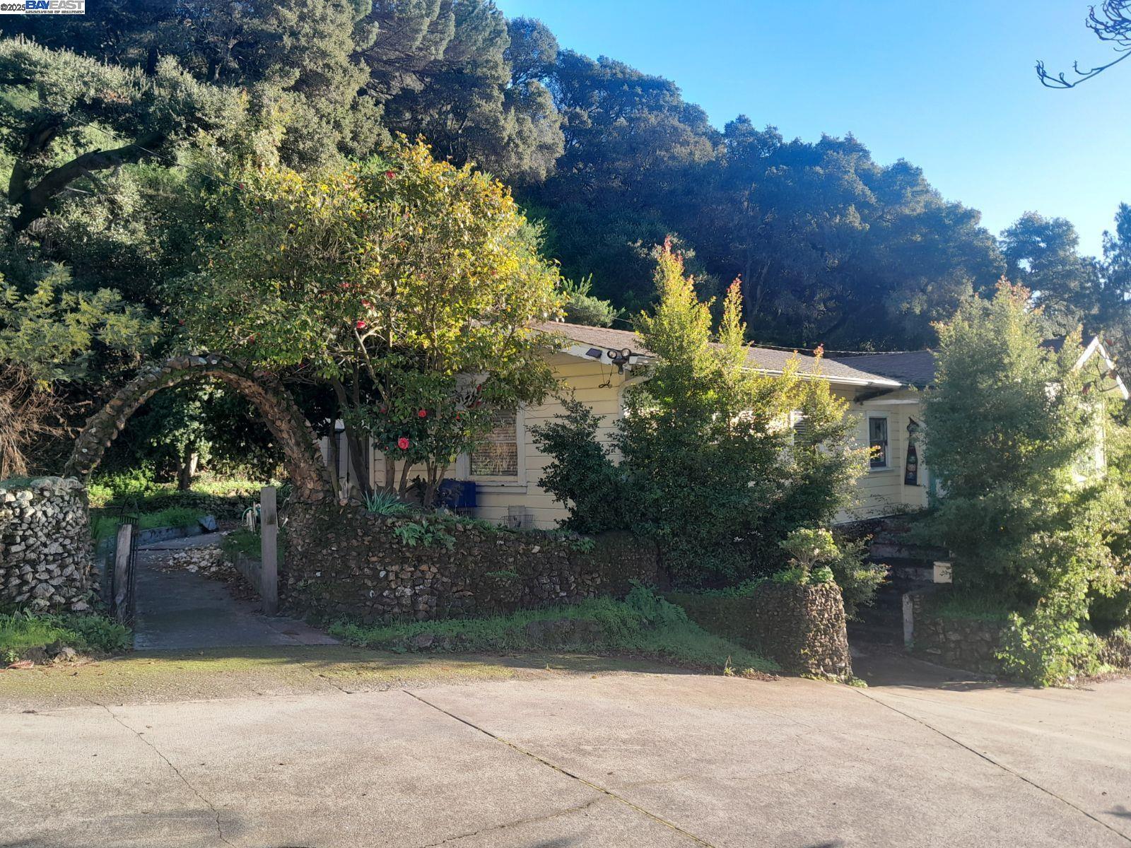 Discover a hidden gem in Leona Heights: a 3-acre urban oasis offering the perfect blend of nature and city living. This exceptional property features: A spacious 5-bedroom main house: Two additional structures: a charming cottage and a versatile barn. (needs work) Stunning Bay views and lush surroundings with mature oak trees. Historic stone terraces and a picturesque fountain. Expansive gardens perfect for nature enthusiasts Nestled at the end of a quiet cul-de-sac, this secluded retreat provides privacy while being conveniently close to urban amenities. The property's unique location in a valley offers natural sound insulation from nearby freeways (13 and 580), creating a tranquil environment1. Zoned RH-3, this property presents exciting development possibilities: Potential for subdivision (buyer to investigate) Opportunity to add ADUs and a JADU in the basement (subject to feasibility study) While the property requires some TLC to restore its natural charm, it offers immense potential for those seeking a one-of-a-kind urban sanctuary. With its combination of space, privacy, and development opportunities, this Leona Heights treasure truly represents a rare find in the Oakland real estate market