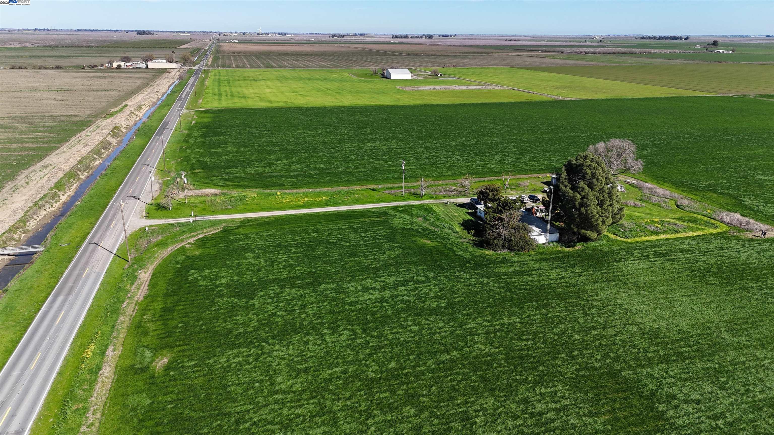 New Price adjustment Almost 80 acres of irrigated ground ready for trees or irriagated pasture for horses or cattle. Great opportunity to own your own peice of paradise. Located in the Maine Prarire Irrigation District. 3 bedroom 2 Bath home large detached garage for workshop. Has excellent location to build your family compound.