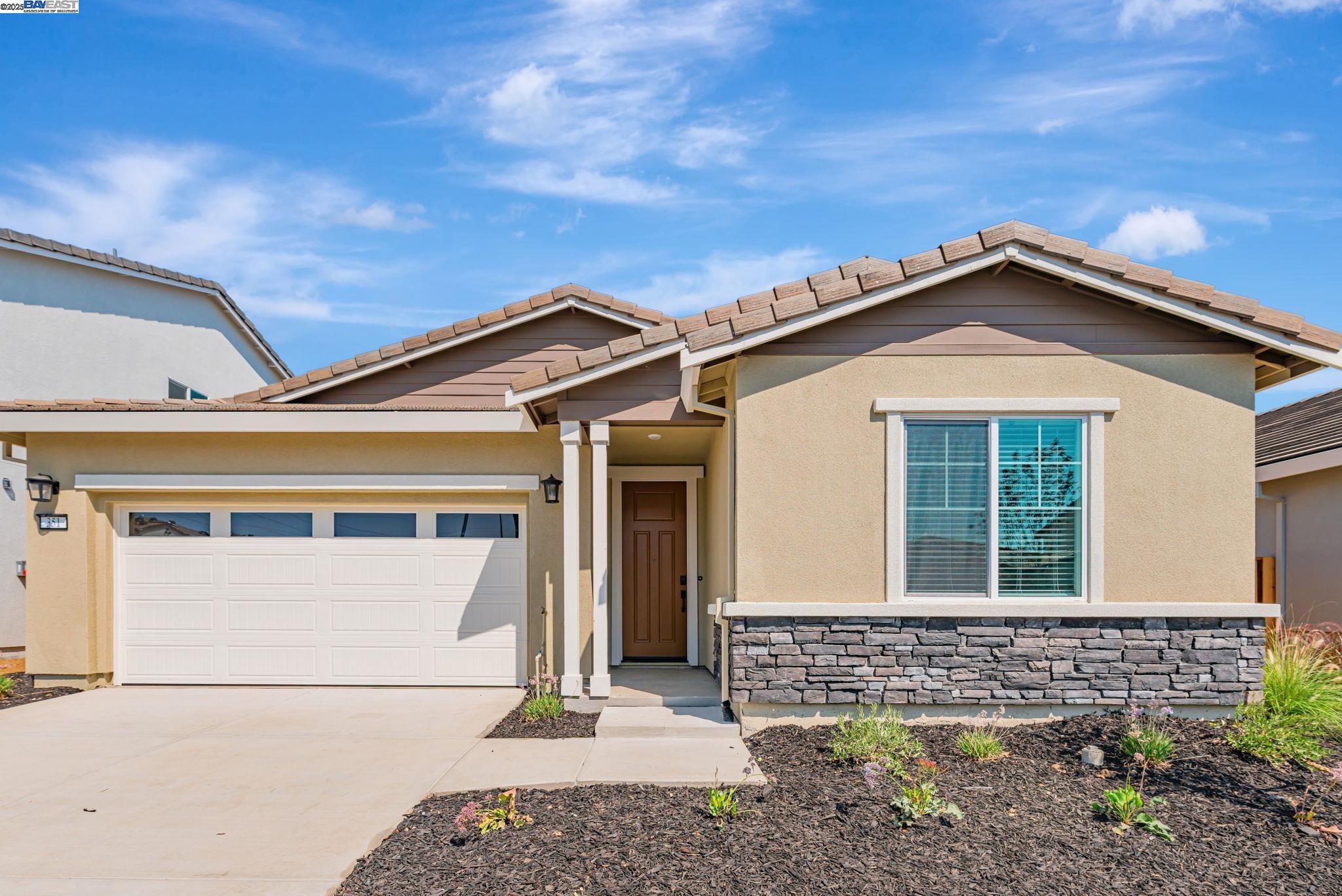 Welcome to Newport Pointe, A New Home – Net ZERO - ALL ELECTRIC Community by Century Communities. This is a Single Story – South Facing lot.  Plan 1 offers 1,708 square feet of living space with 3 Bedrooms, 2 Full Bathrooms and 2 Car Bay Garage.  Home includes cabinets with a Linen finish, concealed hinges and matte black hardware. The kitchen offers Quartz counter tops with a 3x6” tile back splash.  Stainless Steel Whirlpool Appliances with an Electric Range.  Appliances include Refrigerator, Washer and Dryer.  Additional Features include – Blinds, Tub at Primary Bedroom, Solar – Lease and Purchase options, Net Zero Energy Package which includes Energy Efficient Water Heater & Furnace and wired for EV Car Charger – with 240V 40 AMP with Receptacle. Century Home Connect with Safe Haven alarm system, 3 ¼” Base Boards, Luxury Vinyl Plank (LVP) at Throughout home excludes Bedrooms and Closets.  Shaw carpet in Bedrooms and Closets.  Newport Point offers the perfect balance of small-town charm and resort-style living.  Residents will enjoy a wide variety of community amenities designed to elevate everyday life and create memorable experiences. Appliances will be installed soon.