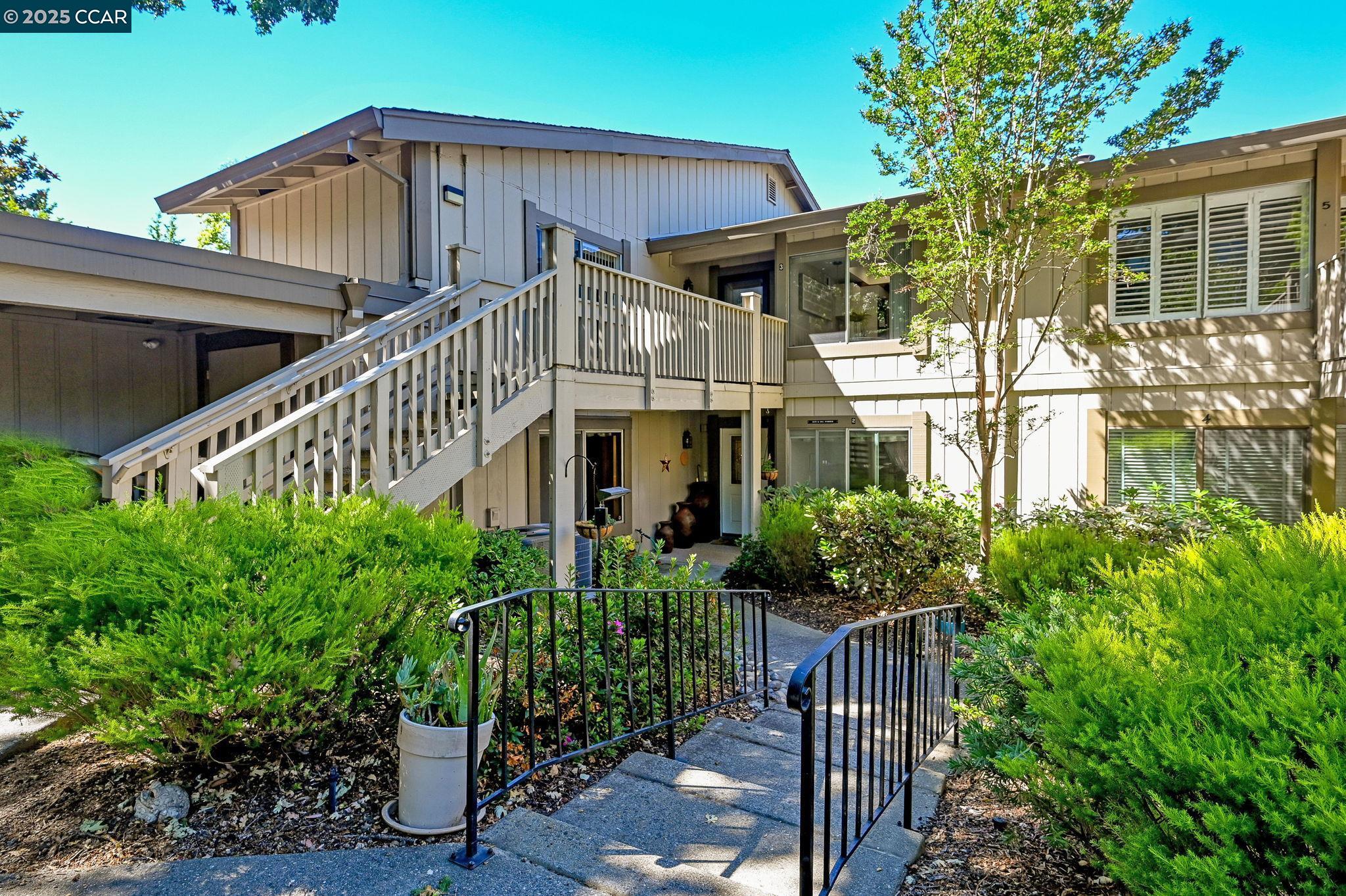 Great Price! Great Opportunity! WOW - Mariposa model -Level Entry - 1 Level floor Plan. 1 Car Garage. Beautiful views of the surrounding hillside. Enclosed Sun Porch/Patio w/sliding glass door and screen, Access to backyard common lawn area. Great location in Rossmoor, 2-3 min to entry. Updated w/new carpet, lots of natural light, open concept floor plan, Large Kitchen & Eating Area, Lg Living Room, Dining Room, and Master Suite! Updated Master Bathroom. Master has entry to sun porch. Living room also has entry to sun porch. Nice size Master suite and 2nd Bedroom! Beautiful Oak Tree in front of unit in sitting area.