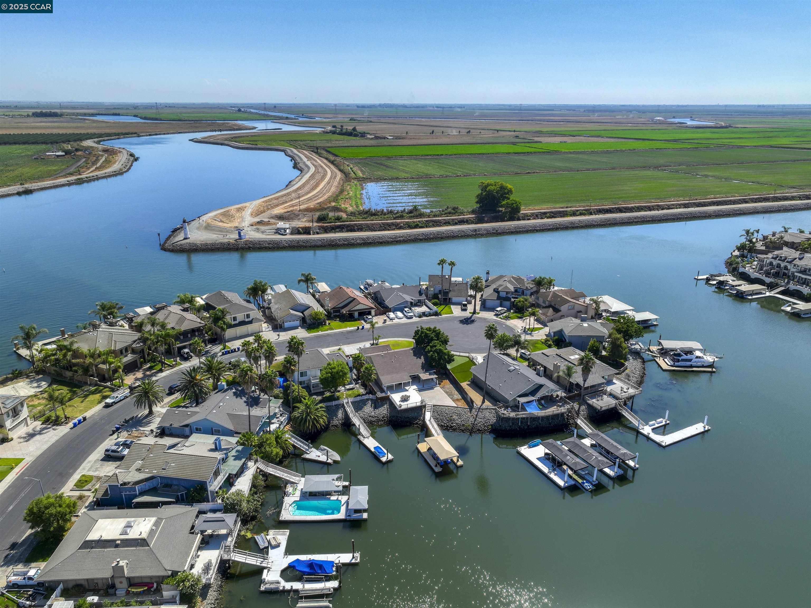 SECONDS to fast water! Truly unique remodeled single story waterfront home on a huge lot. Stunning water views with 102 feet of water frontage. Room to expand home and/or add an in-ground pool, as well as expand the dock. Sought after location. Spacious open floor plan with soaring ceilings and lots of natural light, features 4 bedrooms and 2 bathrooms. Remodeled chef's kitchen features granite slab counters, stainless steel appliances, a massive island with bar seating and a cozy breakfast nook. Primary suite features gorgeous water views and sliding glass door to deck. Beautifully remodeled bathrooms. Gorgeous hardwood flooring. U-shaped dock with room to expand. Perfect for indoor/outdoor living and entertaining. Access to over a thousand miles of delta waterways from your backyard! Large side yard. Hurry this one is truly unique!