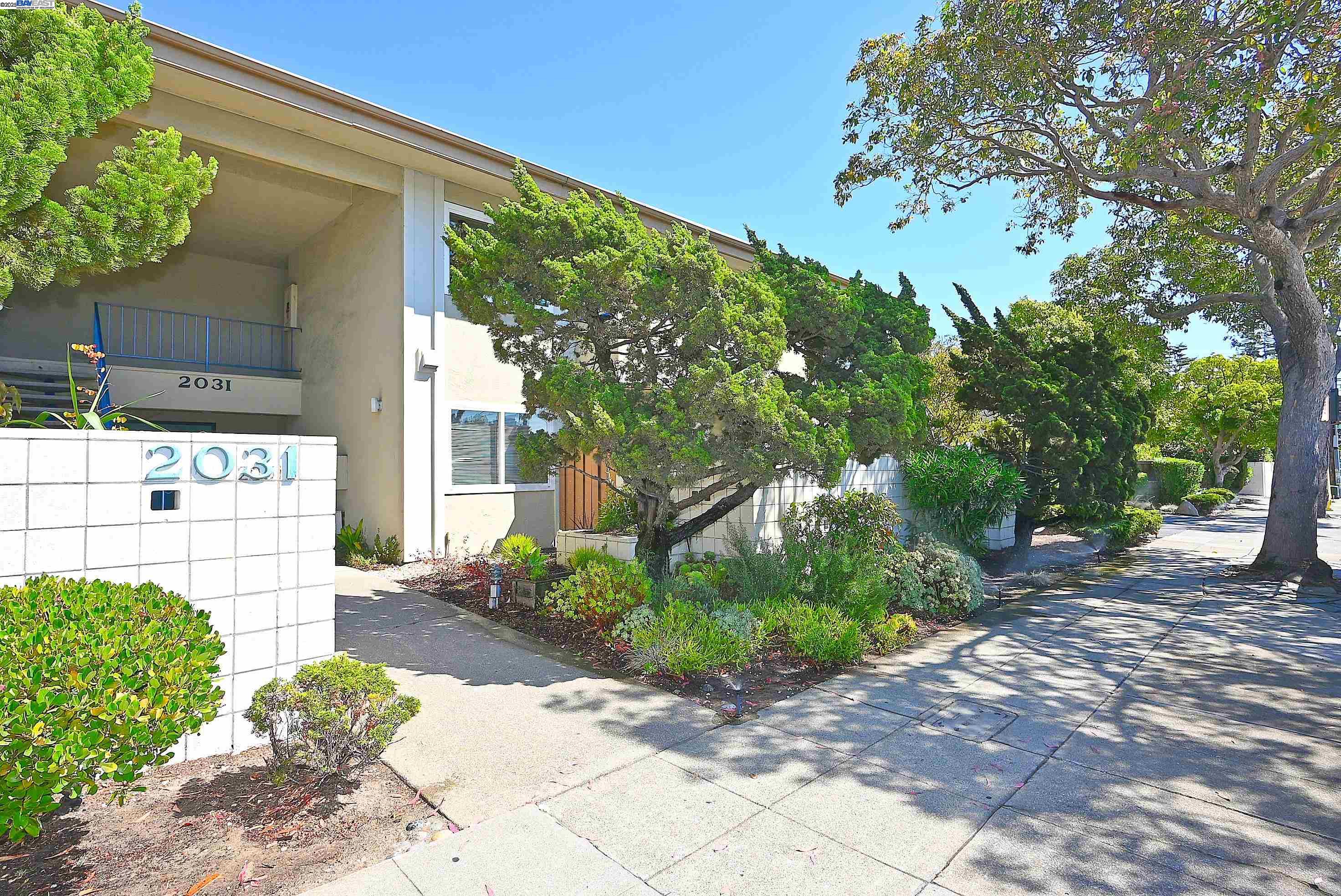 The convenience of condominium living in the heart of Alameda! Beautiful updates to this spacious one bedroom condo include kitchen cabinets, quartz countertops and some new appliances, luxury vinyl plank flooring and fresh paint throughout. Newer dual pane vinyl windows and patio doors with vertical blinds open to a shaded balcony.  The spacious bedroom has a generous walk-in closet with built-in vanity. The bathroom features shower over tub, new coutertop, sink, faucet and light fixture.  Located steps from South Shore Center, this top-floor unit is close to numerous shopping and dining options while also being a stone's throw from the beachfront, with its walking and biking paths and serene sunsets. South Shore Lagoon Condos boasts two swimming pools, two laundry rooms, and gated parking access. Included with this unit is one deeded carport space.