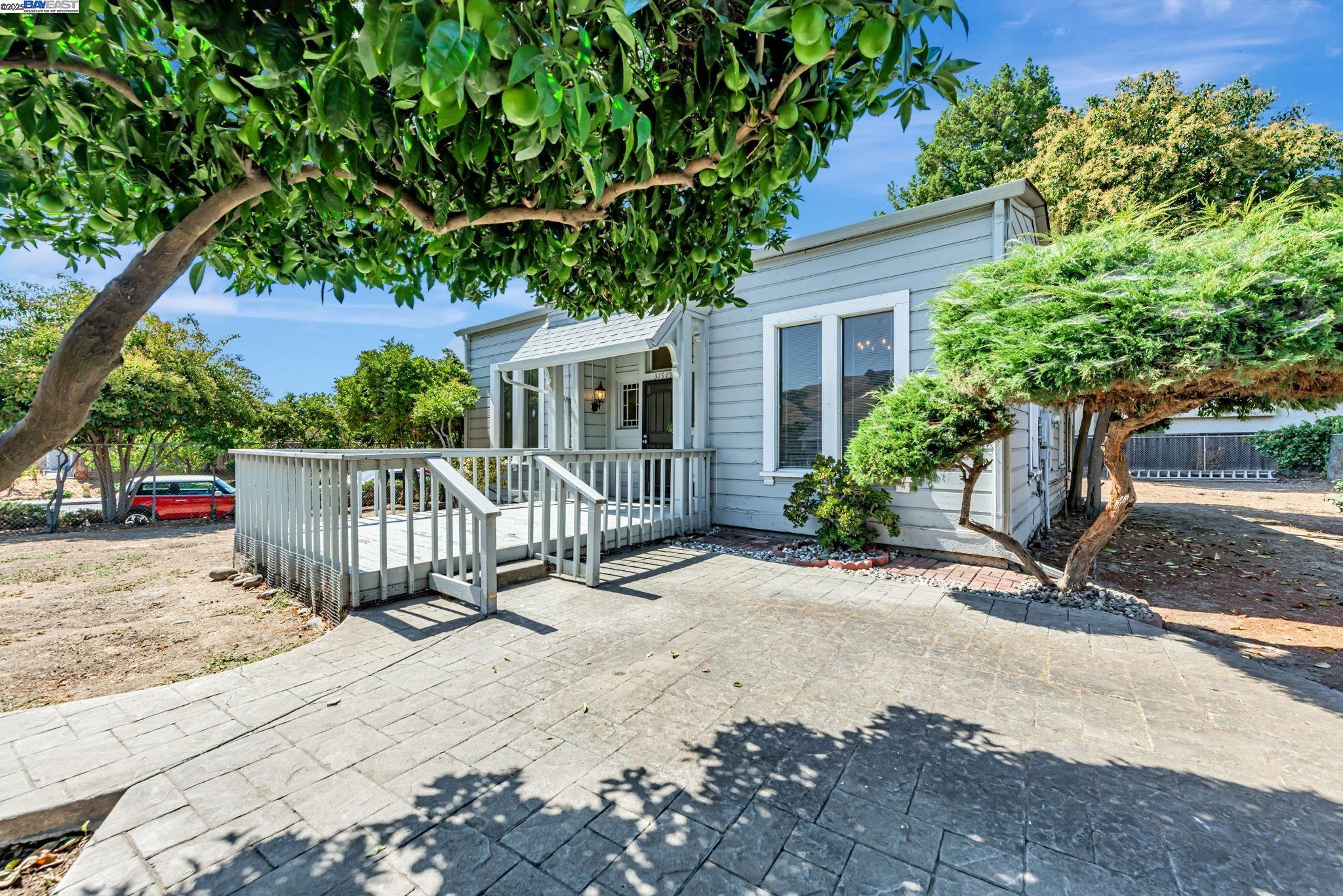 Charming Turn-of-the-Century Opportunity. Step into the past with this 1900-built fixer, brimming with potential and historic character. Original exterior details remain intact, offering a seamless path to restoring its timeless beauty. Inside, you'll find tall ceilings and oversized windows—hallmarks of the era—that flood the space with natural light. Lovingly held by the same family for generations, this was the very first home in the neighborhood, making it a true local landmark. Situated on a level ¼-acre lot, the property offers generous off-street parking and room to expand or landscape to your heart’s content. The prime location is conveniently located near Mission and Niles Boulevard. You're just minutes from shops, dining, and transit—yet nestled in a quiet, established area.