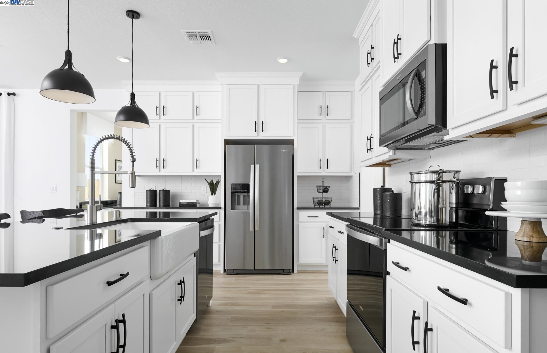 The Stafford new home design features flexible space with 5–7 bedrooms and a large open gathering area made for entertaining. Tour today! Photos of model home not of actual home.