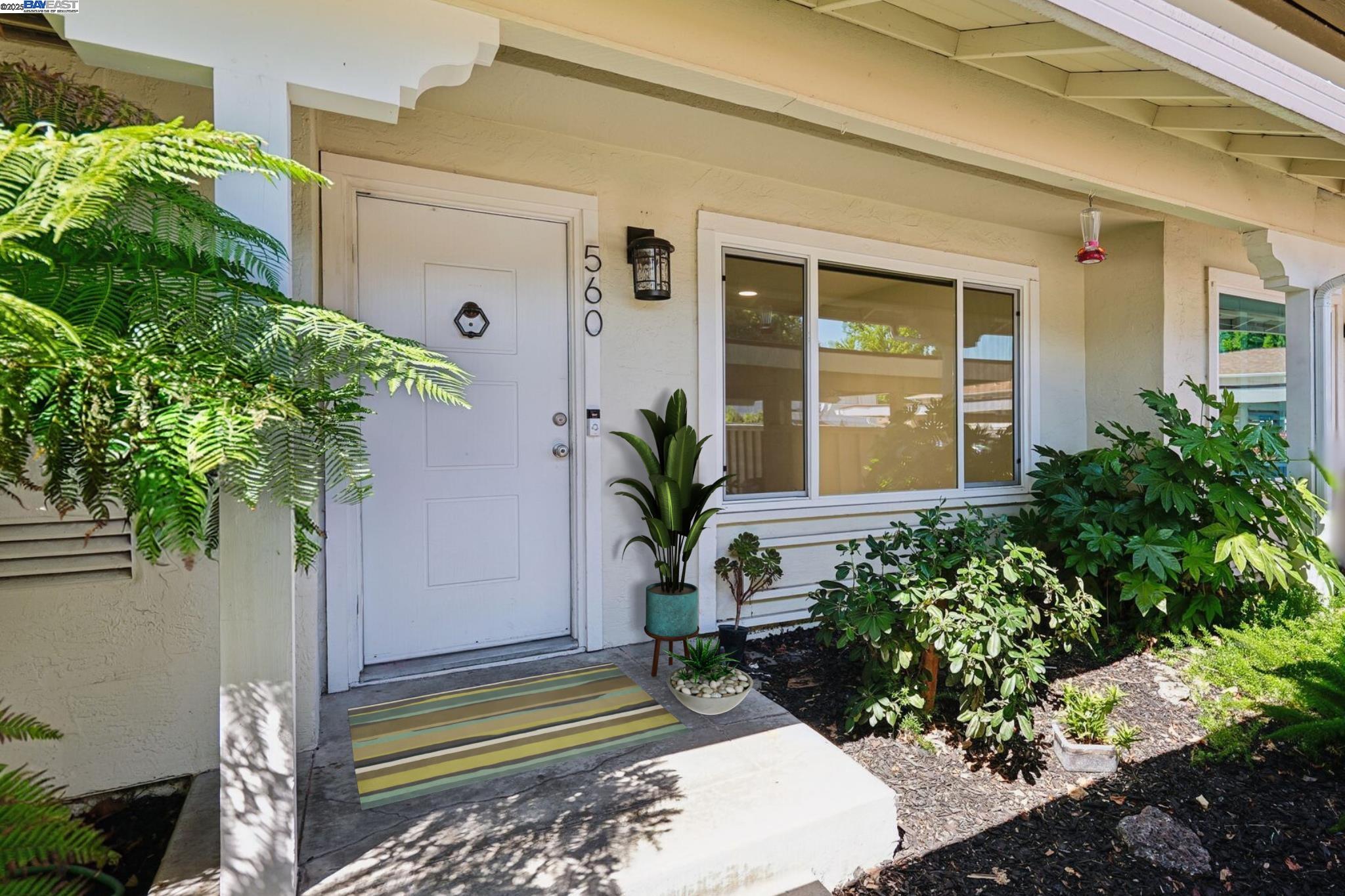 Motivated Seller!!  Beautiful NORTHEAST facing townhome tucked at the end of a quiet court in the desirable Twin Creeks neighborhood!  Recently updated with beautiful elegant oversized tile flooring & baseboards in the living room/dining room/kitchen.  Large spacious light filled living room has new recessed lighting & ceiling fan.  Updated modern kitchen with quartz countertops, full tile backsplash, gray cabinetry & stainless steel appliances, including refrigerator.  Dining Room with plenty of space for entertaining opens to the private back patio with beautifully tiled patio, shade & storage.  Guest bathroom is located off kitchen and laundry closet in kitchen with washer and dryer included has additional overhead storage cabinets.  Spacious primary bedroom upstairs w/mirrored closet doors, new ceiling fan and large window overlooking backyard.  Two additional bedrooms with mirrored closet doors and recently added overhead lights.  Updated full bathroom with newer vanity, sink, light fixture & mirror.  This move-in ready home also features Nest Smart Thermostat, Dual Pane Windows, 1 Assigned Carport Parking Space, Ample Guest Parking and Community HOA Pool.  Located close to top-rated San Ramon Schools, parks, shopping, dining, City Center Bishop Ranch & Easy Freeway Access.