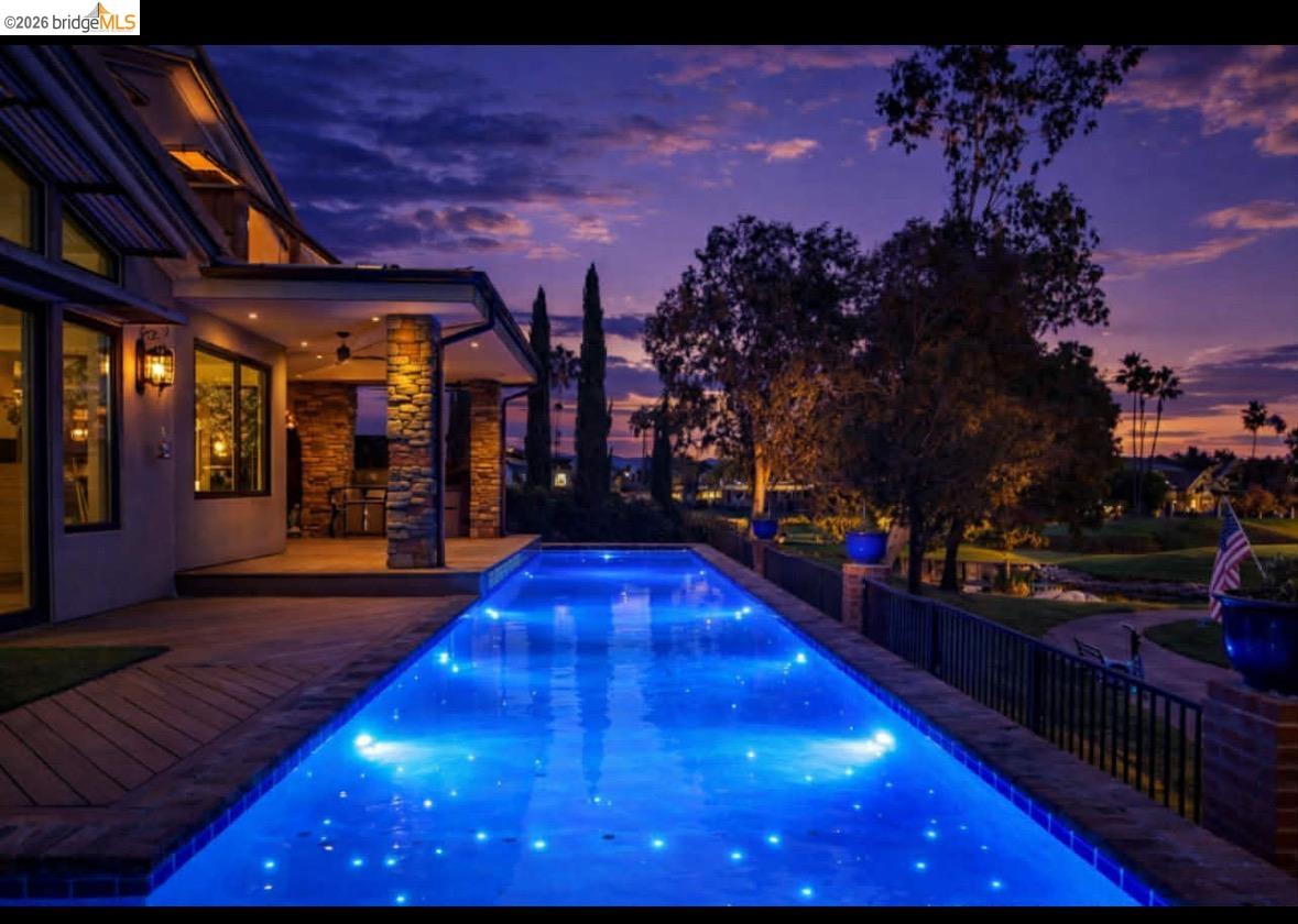 Discover Your Private Oasis in Discovery Bay, California! Nestled on one of the premier golf courses, this exquisite four-bedroom, three-bath luxury estate is a tranquil haven surrounded by lush greenery and stunning views. Enter through the private gates and feel the serenity envelop you. The beautifully designed interior boasts spacious living areas flooded with natural light, showcasing the manicured greens just outside your door. The gourmet kitchen, equipped with high-end appliances, flows seamlessly into the dining area, perfect for entertaining family and friends. Retreat to the luxurious master suite, complete with an en-suite bath and private access to your backyard paradise. The additional bedrooms offer ample space for guests and family. Step outside to your breathtaking backyard, featuring a stunning pool surrounded by lush landscaping—a perfect setting for summer barbecues or quiet evenings under the stars. Imagine lounging poolside, sipping your favorite drink, and soaking in the beauty of your surroundings. This exceptional property offers the ultimate lifestyle of luxury and tranquility. Whether you're looking for a family home or a vacation escape, this estate is a rare find that promises peace and endless enjoyment. Don’t miss your chance to experience the magic