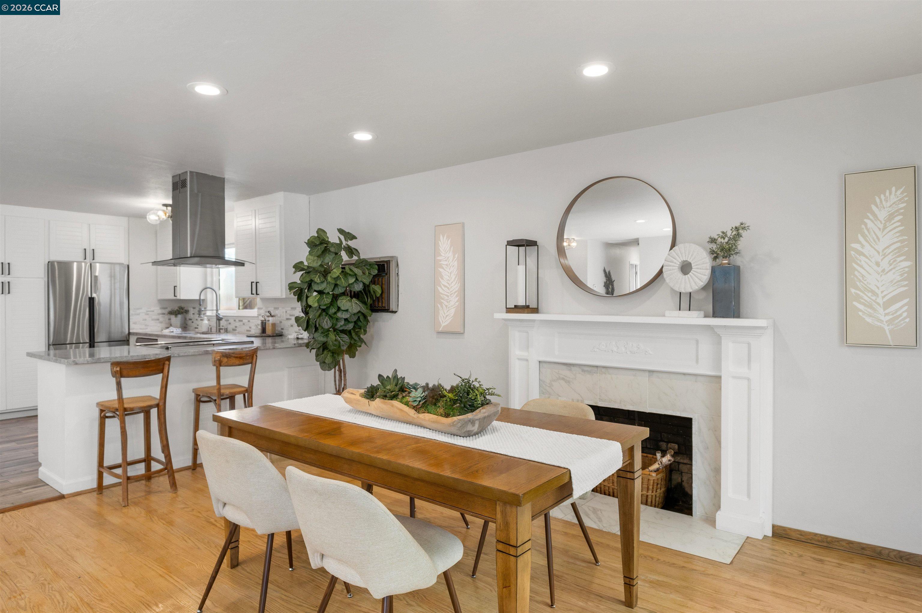 4 bedroom, 2 bath home that offers a balance of style and function that fits real life. Hardwood flooring runs throughout, complemented by newer interior paint and carefully selected light fixtures that give the home a bright, welcoming feel. The layout is intuitive and flexible, w/living spaces that connect naturally with a dedicated laundry area. The garage has been reimagined as a private gym with mirrored walls, creating space for wellness, creativity or whatever suits your lifestyle best; without sacrificing practicality. Outside, fresh landscaping frames the home beautifully and invites you to enjoy the outdoor space as an extension of the interior. Every update has been made with intention, resulting in a home that feels cared for, comfortable and ready for its next chapter. This is a wonderful opportunity to own a home that blends space, tasteful updates, and undeniable charm. Ideally located near neighborhood schools, parks, and everyday shopping, the home also offers exceptional commuter convenience with quick access to BART and major freeways, making daily commuting and weekend adventures throughout Concord and the greater Bay Area effortless.