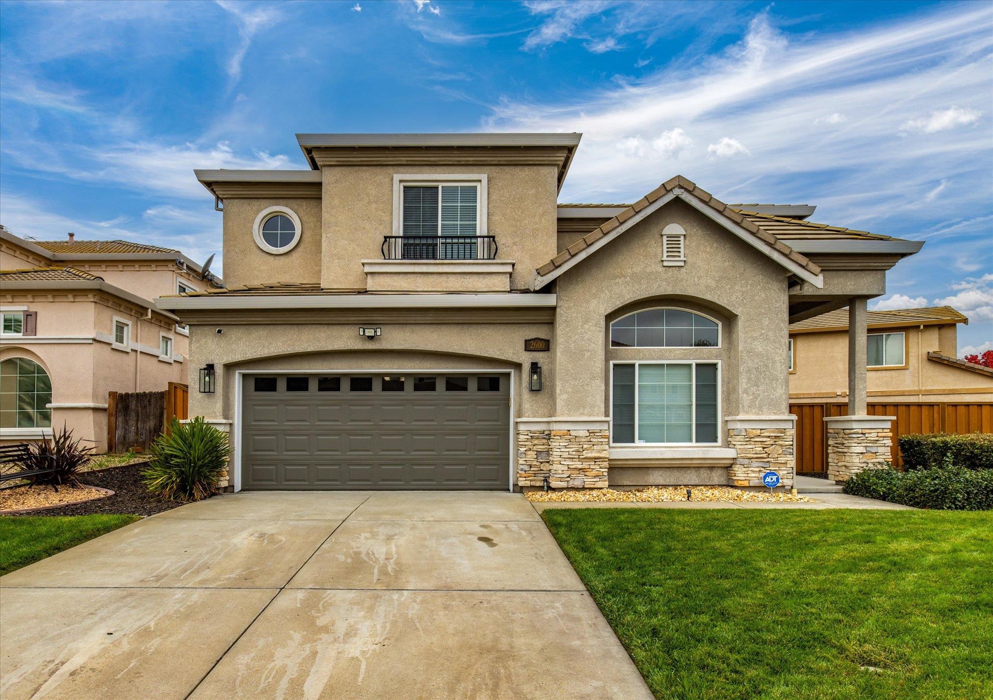 Welcome to 2600 Covelite Way. This spacious and well-appointed 4-bedroom, 2.5-bath home offers approximately 2,208 sq ft of comfortable living space. Soaring ceilings enhance natural light and create an open, inviting atmosphere throughout. The main level features a living room, dining area, kitchen with island, half bathroom, a cozy fireplace, and interior access to a 2-car garage. All four bedrooms are located upstairs, including a generous primary suite that serves as a private retreat with a spacious bedroom and a spa-inspired bathroom. Situated on a premium 8,294 sq ft corner lot, the expansive backyard is ideal for entertaining and recreation, featuring a basketball court, play area, and ample space for a potential swimming pool. A functional layout with excellent indoor and outdoor living potential makes this home a standout opportunity.
