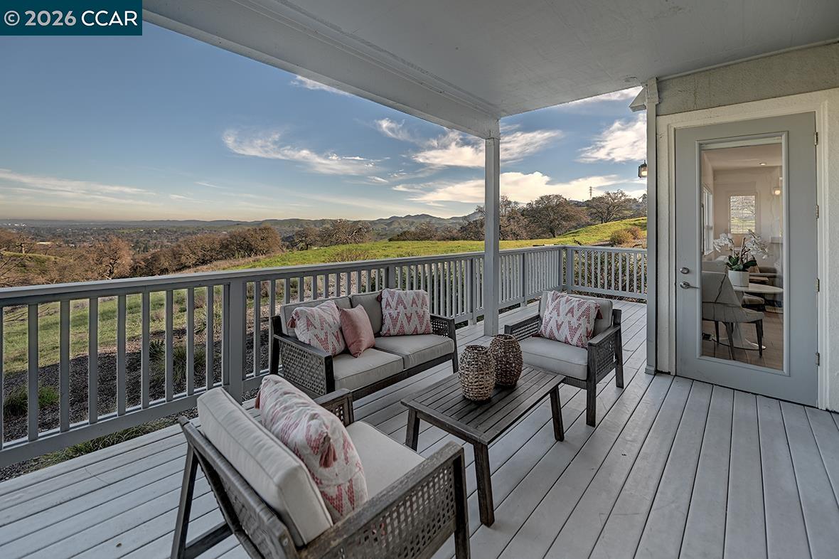 This exceptional level-in home is bathed in warm natural light, offering expansive panoramic views and beyond through large picture windows.  Thoughtfully updated with all the features you are looking for. With easy level-in access and a rare combination of elegant interiors and seemingly private, breathtaking views, this home offers comfort, style, and effortless living. Truly impressive—Welcome Home!