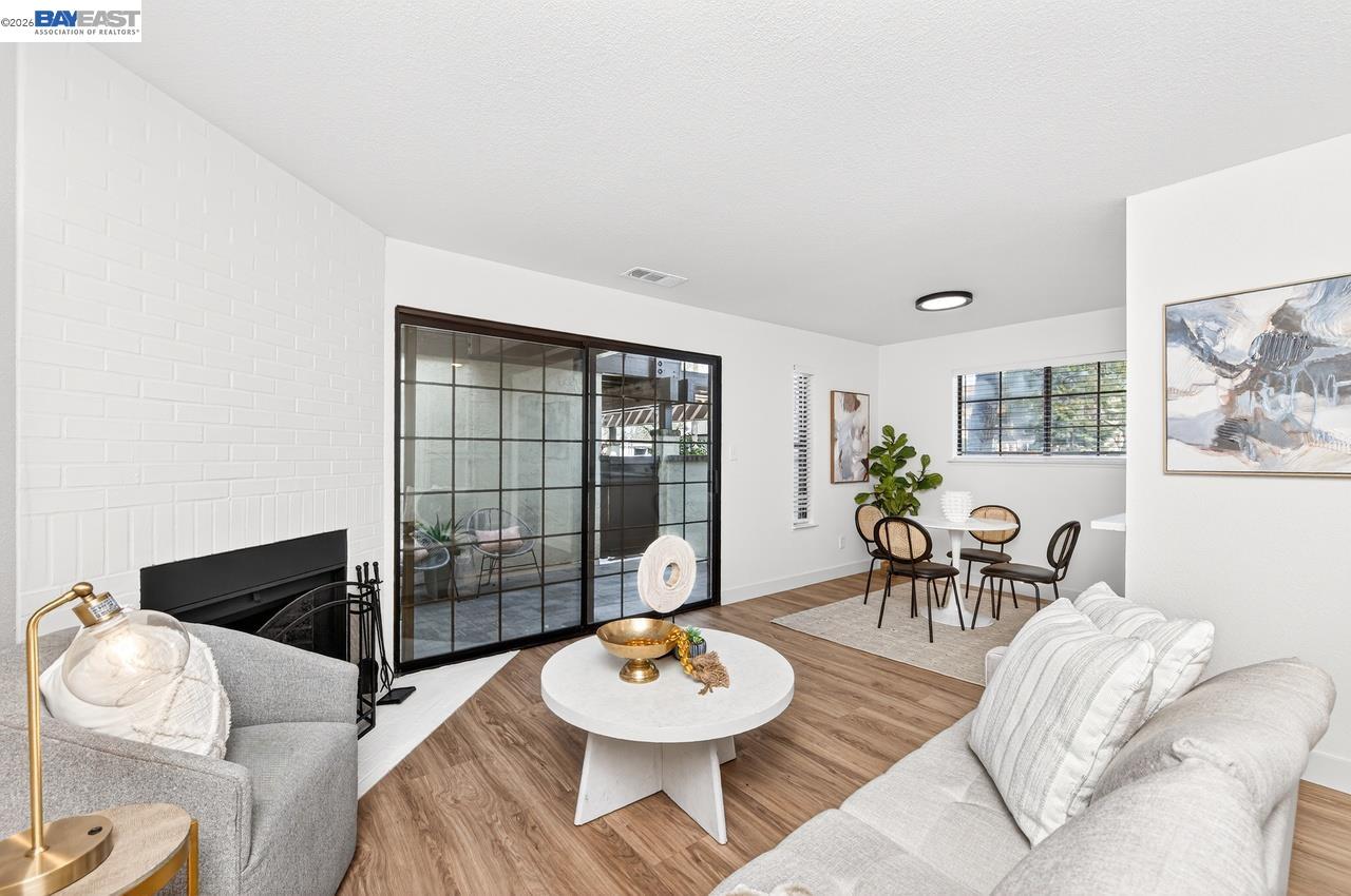 Charming ground-floor condo located in the heart of downtown Pleasanton. This bright and airy 2-bedroom, 2-bath home offers approximately 964 square feet of comfortable living space. Fully updated throughout. The open layout features laminate wood flooring throughout, creating a warm and cohesive feel across the living areas. The kitchen is fully updated with open feel and new appliances.   Both bedrooms offer generous closet space, and the home includes two full bathrooms for added convenience. Additional highlights include in-unit washer and dryer, air conditioning, two private patio, and a dedicated carport parking space.  Located just minutes from historic downtown Pleasanton, you’ll enjoy easy access to restaurants, shopping, parks, and top-rated Pleasanton schools.