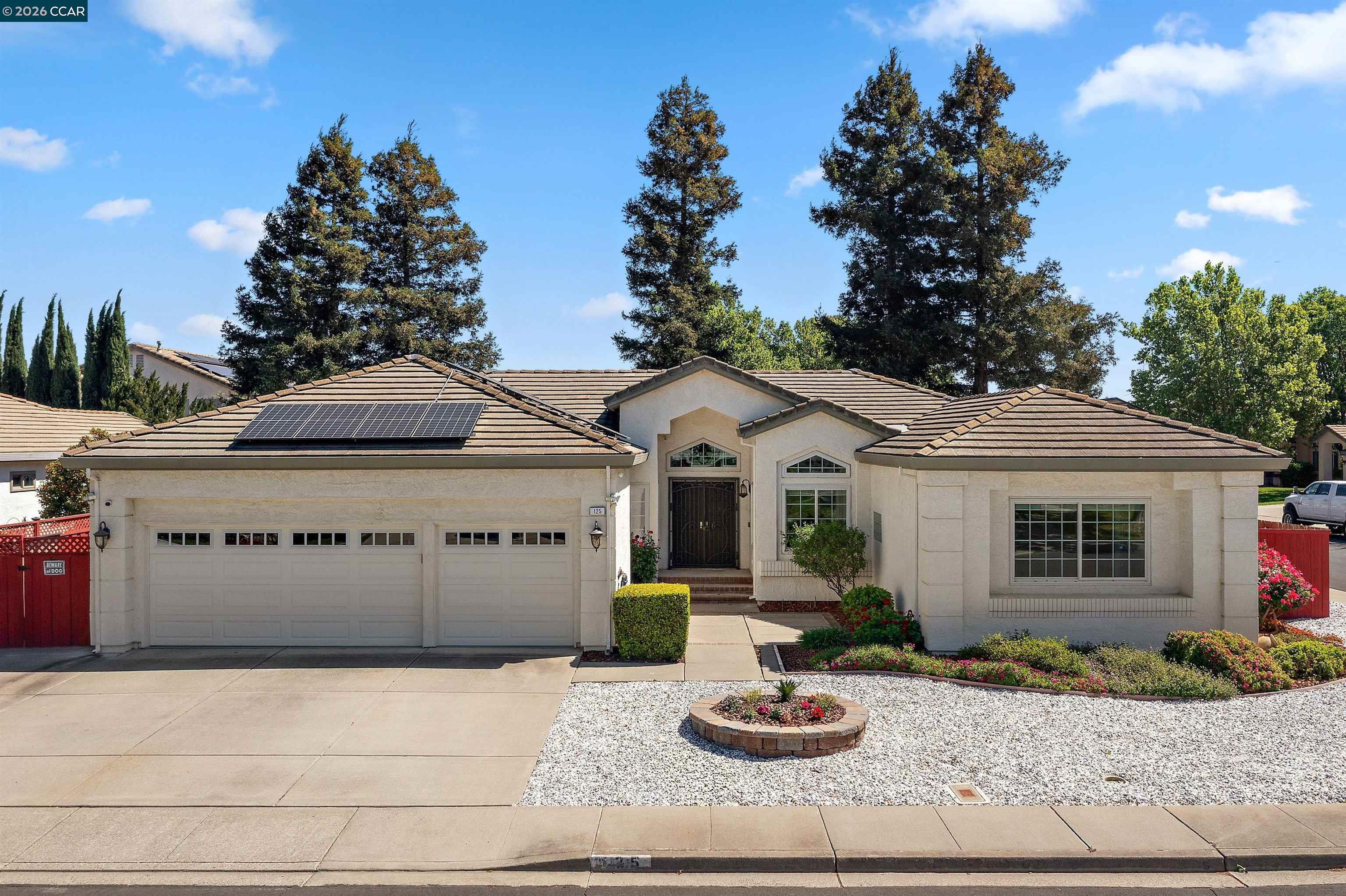 Welcome to this beautifully maintained home in Vacaville’s sought after neighborhoods, where thoughtful upgrades, modern efficiency, and seamless indoor outdoor living come together effortlessly. A striking double door entry opens to light filled interiors with vaulted ceilings, Beautiful flooring, and inviting spaces designed for both everyday comfort and elevated entertaining.  The chef’s kitchen is a standout, featuring granite countertops, a center island, double ovens, a gas cooktop with pot filler, and custom cabinetry, all enhanced by abundant natural light.  Step outside to the backyard complete with a fully covered outdoor kitchen, including a built in barbecue, refrigerator, and sink, along with expansive patio space and multiple areas for entertaining or relaxing in a private, tranquil setting.  Designed with today’s lifestyle in mind, the home includes solar system paired with an owned Tesla battery backup, EV charging in the garage, and a whole house water filtration system for enhanced efficiency and everyday comfort.  Ideally located near shopping, dining, parks, and commuter routes, this is a rare opportunity to own a move in ready home in one of Vacaville’s most established neighborhoods.