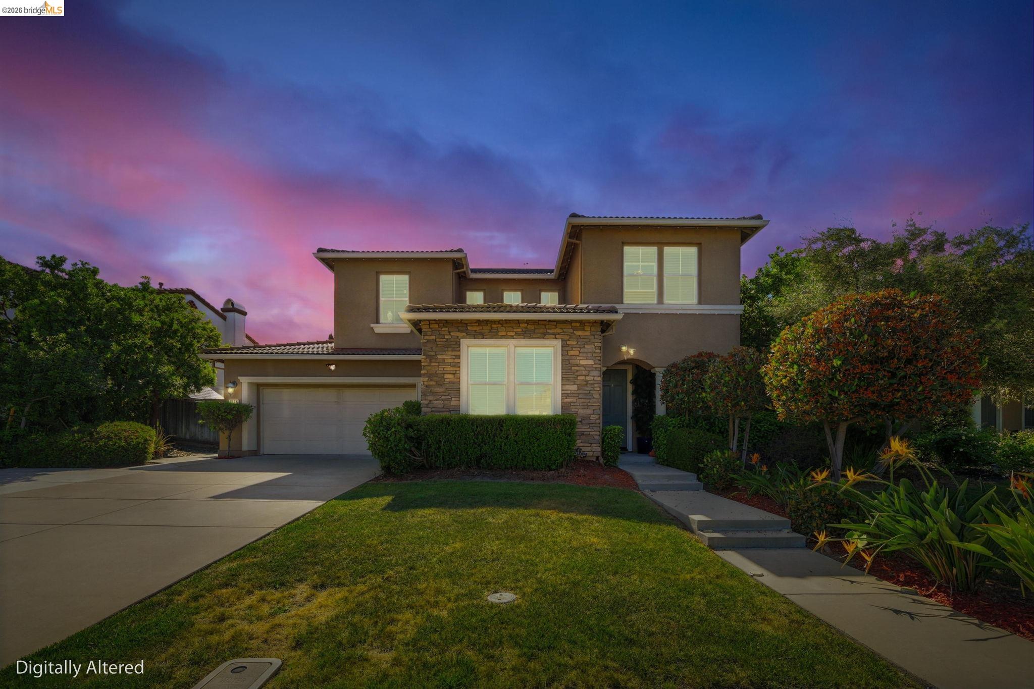 Welcome to this spacious 2,718 sq ft single-family home featuring 4 bedrooms and 2.5 bathrooms, designed for comfort and style. The open layout showcases a large kitchen island, stone counters, stainless steel appliances, and abundant cabinetry—perfect for entertaining and everyday living.  Enjoy tile flooring throughout, recessed lighting, vaulted ceilings, a cozy gas fireplace, and a modern iron staircase. The home also features updated bathrooms, a walk-in closet, and an additional kitchen in the garage for added flexibility.  Situated on a massive 13,836 sq ft lot, the property includes an extended driveway for boat and RV parking, a hillside backyard with expansion or ADU potential, covered patio, outdoor kitchen, terraced landscaping, Govee permanent lights, and ambient lighting—creating an entertainer’s dream.  Energy-efficient with a fully paid-off Tesla battery, plus a 3-car tandem garage with workshop space, multi-zone A/C, and ample storage. Too many upgrades to list—this move-in-ready home is a must-see!