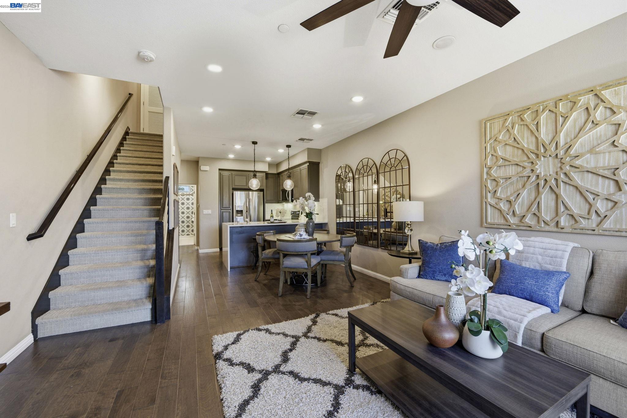Welcome to this stunning 3BD/3BA townhome in Fremont’s desirable Renato community by Pulte Homes. Originally the premier community model, this highly upgraded home offers ~1,652 sq. ft. of stylish modern living across three levels.  The bright, open-concept main level features a chef’s kitchen with quartz countertops, a waterfall island, upgraded backsplash, and stainless steel appliances. The flexible lower-level suite features charming French doors opening to a private front patio—ideal for a home office, guest space, or multigenerational living.  Property Highlights: • Eco-Friendly: Fully paid solar & 220V EV charging outlet in the 2-car garage. • Premium Upgrades: Upgraded flooring, designer lighting, under-cabinet illumination, and upgraded stair rail. • Turn-Key & Modern: Built in 2020 with pristine, model-home designer touches throughout. • Unbeatable Location: Commuter's dream near I-880, Hwy 84, BART, Centerville Station, great dining, shopping, and top-rated schools. A rare opportunity to own a newer-construction, feature-packed home in one of Fremont’s most convenient neighborhoods. Move-in ready and easy to show!