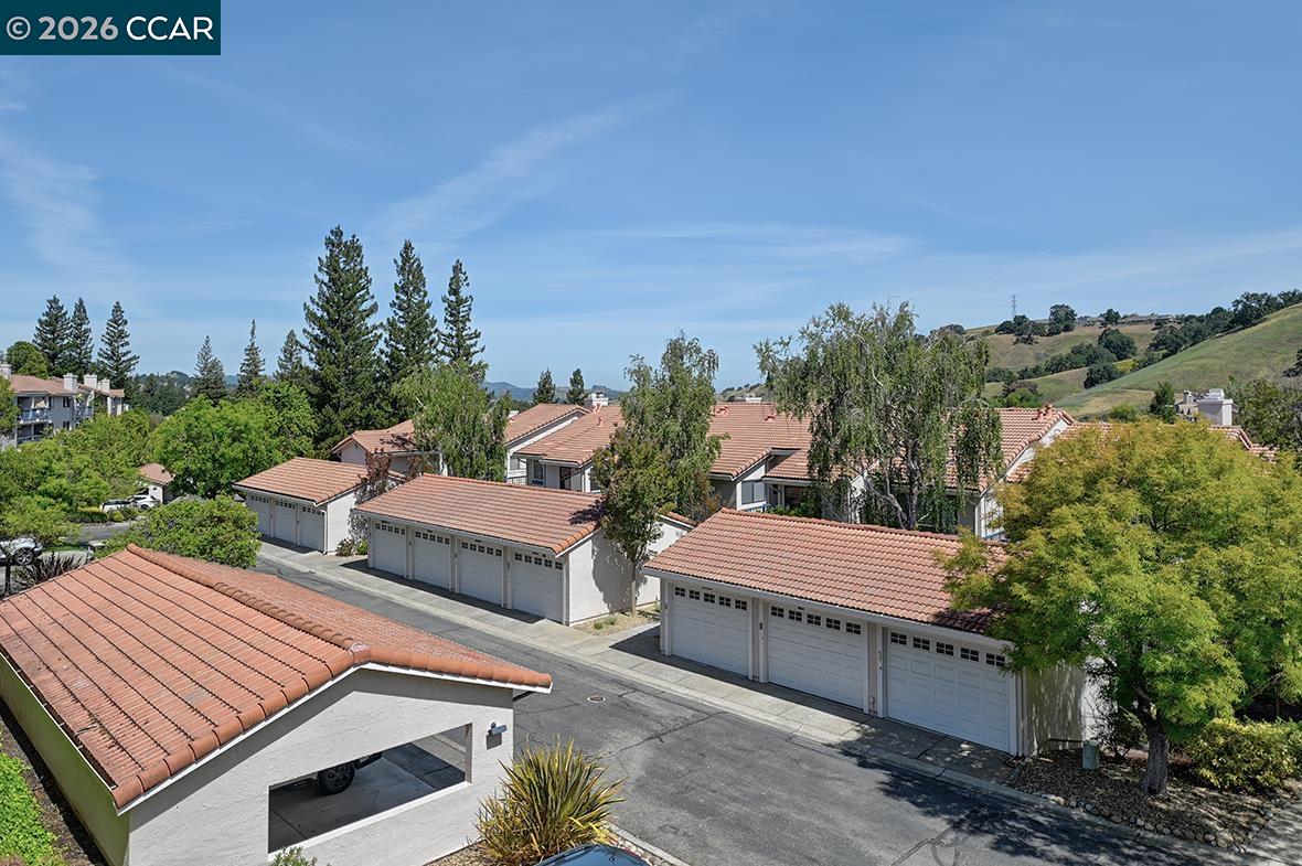 Start living the dream in Rossmoor, Walnut Creek's premier active adult community. Lavish Remodeling touches wherever you look: The light and airy Tastefully Remodeled Eat-In Kitchen boasts updated stainless steel appliances, including a gas range. There is a lighted, spacious pantry, a greenhouse window, and a veranda, overlooking a stunning view of the valley. There is an ADDITIONAL ROOM, currently being used as an office, but could be a den or a dining room Primary bath has a stall shower, and the hall bath includes a tub.  The Living Room features a cozy fireplace, and a custom wall unit.  The Heating and Air Conditioning is forced air, with a modern WiFi thermostat. This home was reimagined by Toupin Construction about 10 years ago, but the finishes were done so tastefully, that the look is timeless.