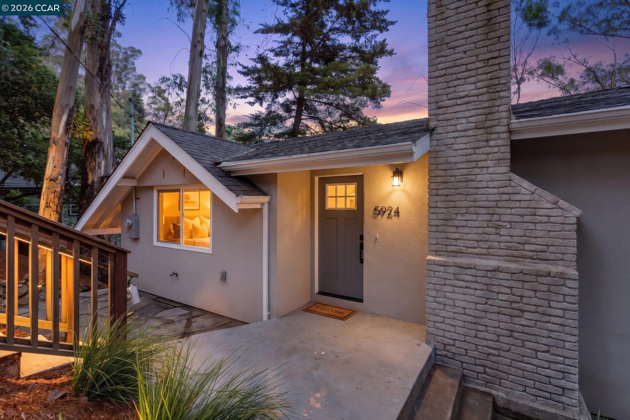 Tucked into the treetops of Montclair Hills, this beautifully remodeled single-level home feels like a private hideaway — minutes from the shops, cafés, and trails. A beautifully landscaped front courtyard doubles as your outdoor living space with space for additional storage solutions. Inside, the light-filled floor plan is anchored by a stunning remodeled kitchen with white oak cabinetry, quartz counters, and a 5-burner gas range. Both bathrooms are beautifully renovated, and the home is move-in ready with dual-pane windows, stone composite flooring, a wood-burning fireplace, and in-unit laundry. Step out back to the back deck surrounded by greenery and take advantage of the dedicated exterior storage closet under the house for all your gear. Major systems — electrical, plumbing, and roof — are already updated, so this one's truly turnkey. Two designated parking spaces, single-level ease once inside, and one of Oakland's most beloved neighborhoods right outside your door. OPEN SAT & SUN, 8/1 and 8/2 (2 - 4 pm both days)