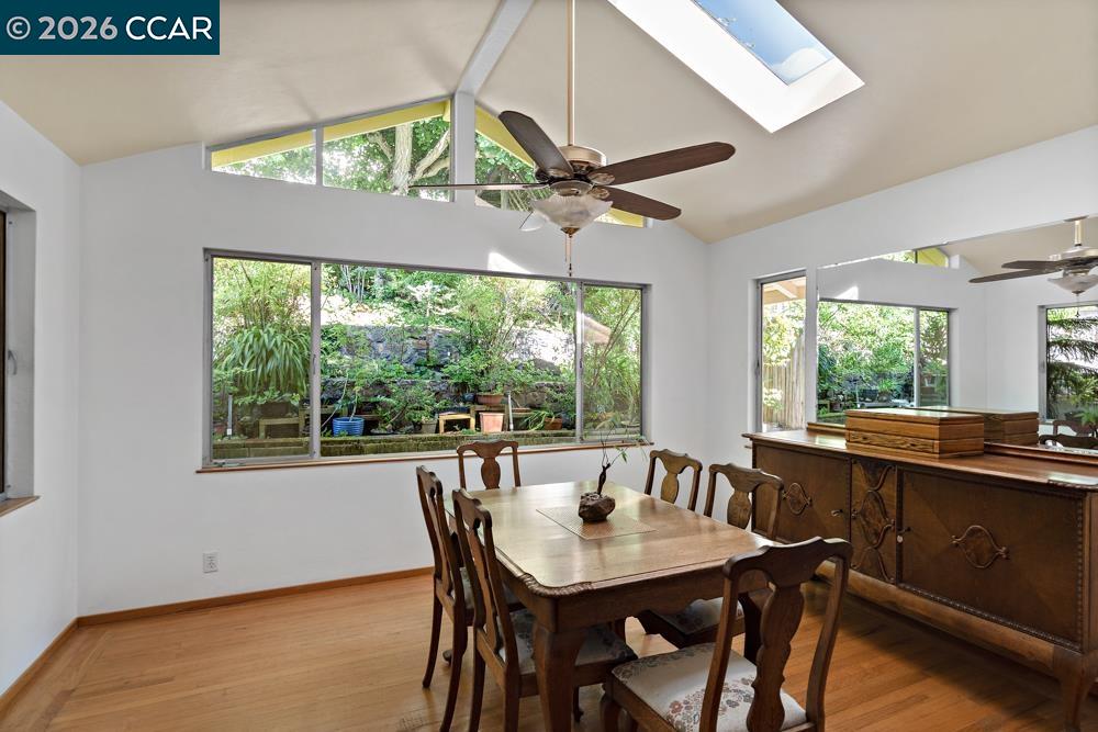 Tucked along a quiet Castro Valley street, this inviting home offers the perfect balance of timeless character, everyday comfort, and exciting potential. From the moment you arrive, there's a sense that this is a home that's been thoughtfully cared for and is ready for its next chapter.  Inside, hardwood floors add warmth throughout much of the home, while the functional four-bedroom, two-bath layout provides flexibility for growing families, remote work, or multigenerational living. Every space feels comfortable, welcoming, and filled with natural light.  The heart of the home is the expanded dining room, where walls of windows frame views of the backyard and create an airy gathering space for everything from casual breakfasts to holiday celebrations. It's a room designed for connection and one that naturally draws everyone together.  Outside, the property continues to impress with multiple outdoor spaces to relax, entertain, garden, or simply enjoy the peaceful surroundings. Above the backyard, the detached structure has been transformed into a versatile bonus room. Beneath it, a spacious workshop offers exceptional flexibility for hobbies, storage, creative studio, or the potential to explore an ADU conversion (buyer to verify).  Whether you're looking for a home to enjoy immediately or one you can thoughtfully personalize over time, this property offers the rare combination of move-in-ready comfort, versatile spaces, and the opportunity to build lasting value in a desirable Castro Valley location.