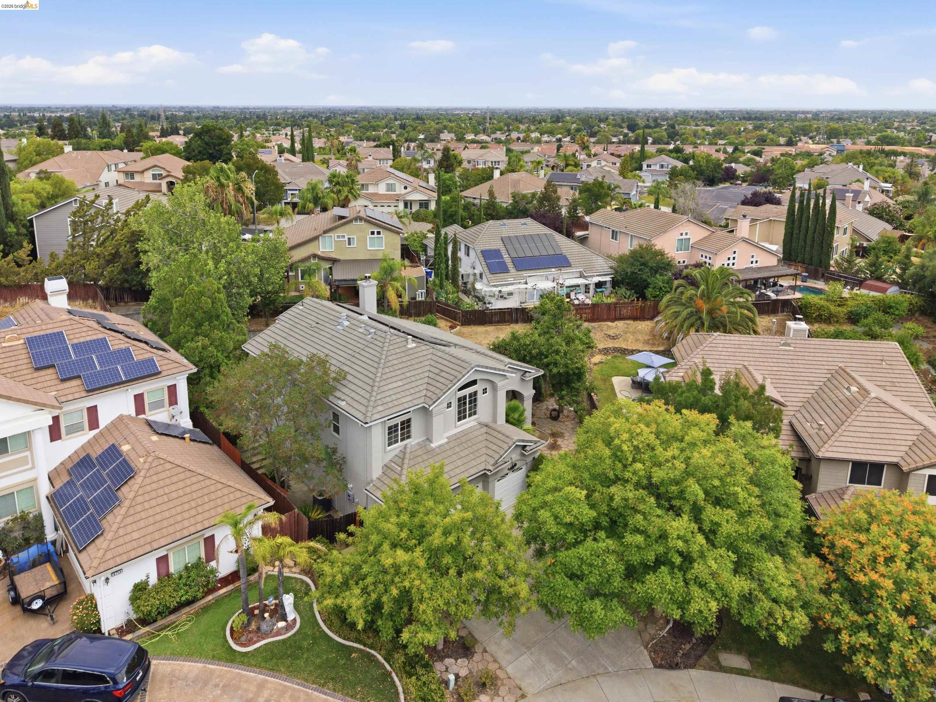 Located in the desirable Shadow Lakes neighborhood, this spacious home is perfectly positioned on a premium oversized lot, offering picturesque views of the golf course, lake, and iconic Mount Diablo. No HOA. The versatile split-level floor plan is designed to accommodate a variety of lifestyles. The entry level features a welcoming living room, a bedroom, bonus area, laundry room, and a recently updated full bathroom, making it ideal for guests, multigenerational living, or a private home office.  Up a short flight of stairs, you'll find the main living area, where a family room with a fireplace flows into the spacious eat-in kitchen. The kitchen offers generous counter space, ample cabinetry and charming garden windows that bring in natural light.  The upper level features four bedrooms, including the spacious primary suite. The suite includes a unique anteroom, separated from the bedroom by a double-sided fireplace that creates the perfect divider between the two spaces. The anteroom offers endless possibilities as a home office, reading nook, sitting area, or exercise space.   The hallway bathroom has also been recently updated with modern finishes. Additional updates include a newer water heater and newer washer and dryer.   The backyard features mature fruit trees including apricot, persimmon, grapevines, pomegranate, and lemon, along with plenty of space to relax, entertain, or simply enjoy the peaceful setting.   Enjoy easy access to nearby parks, top-rated schools, shopping, dining, and Highway 4, making commuting and daily errands a breeze while still enjoying the beauty of this established neighborhood.
