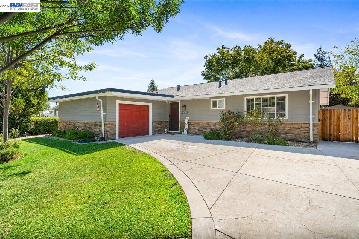 Welcome to 1280 Tulip Way, where style, comfort, and convenience come together in one beautifully remodeled home. Perfect for first-time buyers, downsizers, or anyone seeking a move-in-ready property, this meticulously updated 3-bedroom, 2-bath residence offers modern finishes and thoughtful upgrades throughout.  Step inside to discover a light-filled interior featuring a beautifully remodeled kitchen and bathrooms, updated flooring, fresh finishes, and quality craftsmanship at every turn. The functional floor plan provides comfortable living spaces designed for everyday living and effortless entertaining. Outside, the spacious landscaped backyard offers endless possibilities—create your dream garden in the planter box, entertain family and friends, or simply enjoy the extra room to relax. A two-car garage provides ample parking and storage. Ideally located in an established Livermore neighborhood close to parks, scenic trails, new 18-hole disc golf course, schools, shopping, dining, Livermore Valley renowned wine country, and easy access to I-580. This turnkey home is an exceptional opportunity. Don't miss your chance to own a beautifully renovated home that's ready for you to move in and enjoy from day one.