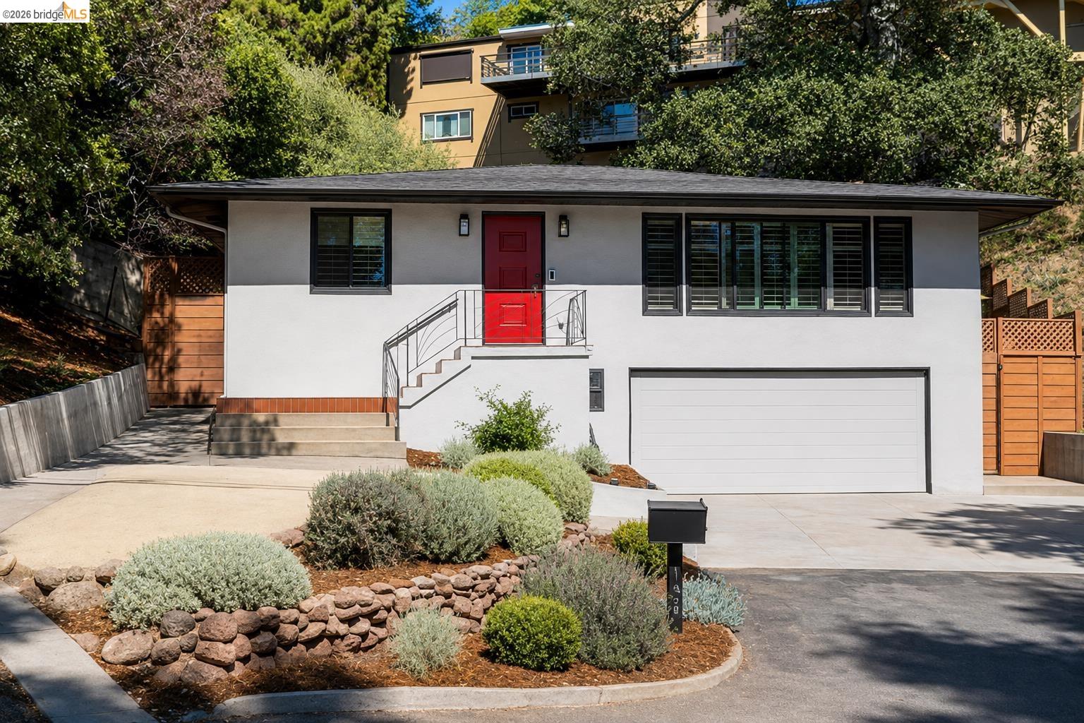 Welcome to this beautifully updated contemporary Montclair home offering approximately 1,600 sq. ft. of living space with three bedrooms and two remodeled bathrooms. Thoughtful upgrades include a remodeled kitchen, a luxurious steam shower, new dual pane windows, and stylish modern finishes throughout. The lower level provides an additional approximately 385 sq. ft. workshop and bonus area, offering excellent flexibility for hobbies, storage, a home gym, or creative use, plus an attached approximately 427 sq. ft. garage. Ideally located within walking distance of Montclair Village, local schools, tennis courts, shops, cafés, and restaurants. Convenient access to Highways 13 and 24, public transportation, and nearby East Bay amenities makes commuting and everyday living easy. Buyer to verify square footage, permitted use, and all property details.