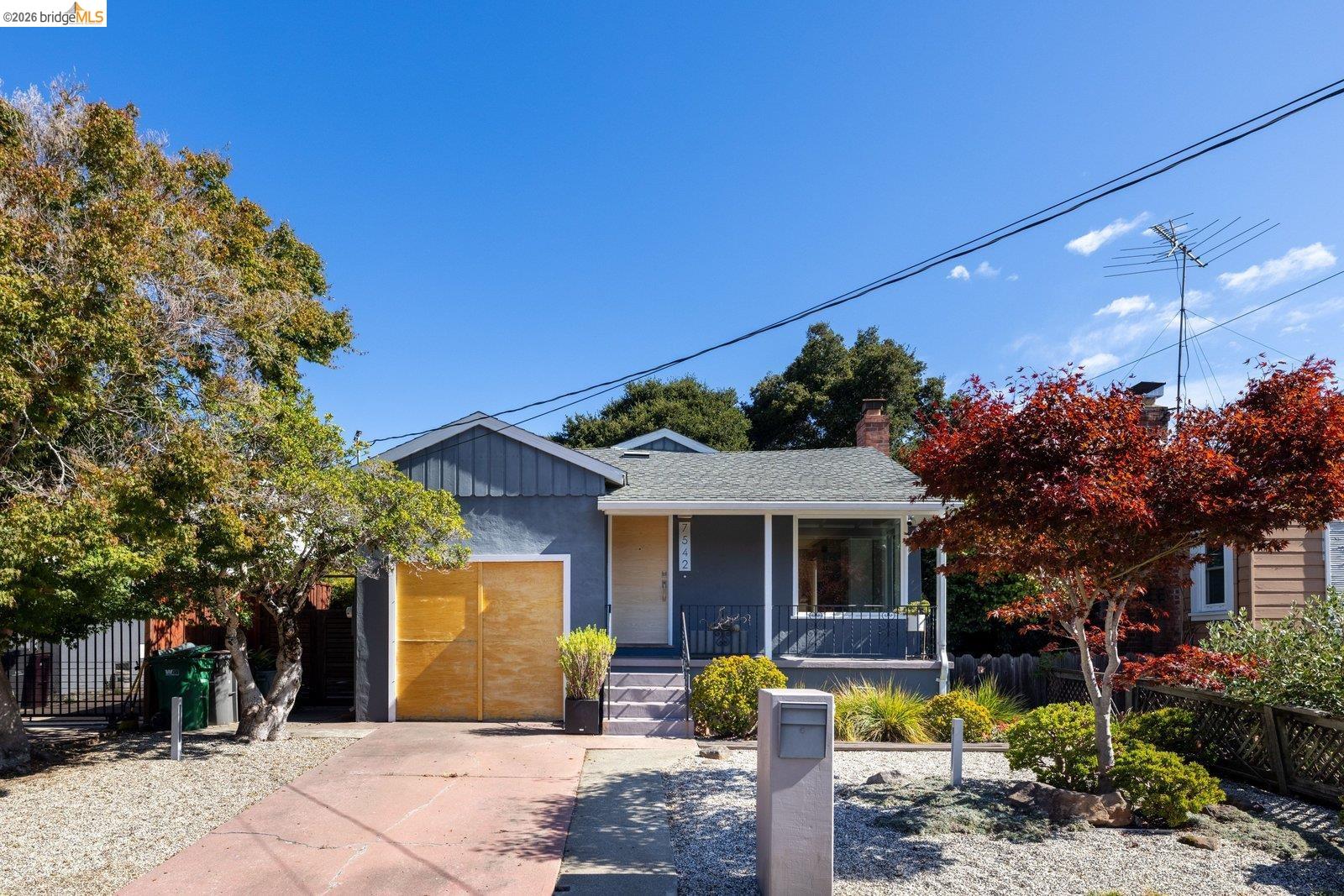 Open Sat/Sun 2-4pm! 7542 Valentine Street will steal your heart! Set on a lovely two-block street on the northern border of the desirable King Estates neighborhood, this sunny mid-century charmer offers modern windows, refinished hardwood floors, bright and charming kitchen, updated bath with custom vanity & soaking tub. Newer furnace + AC, 2 generous bedrooms, open living/dining, attached garage & laundry. Expansive lot with ADU potential, elegant low-maintenance front yard, and spacious rear yard with garden shed. Easy I-580 access, just minutes to wonderful hiking, recreation, shopping, dining, and everything we love about Oakland. Don't miss this fabulous opportunity!