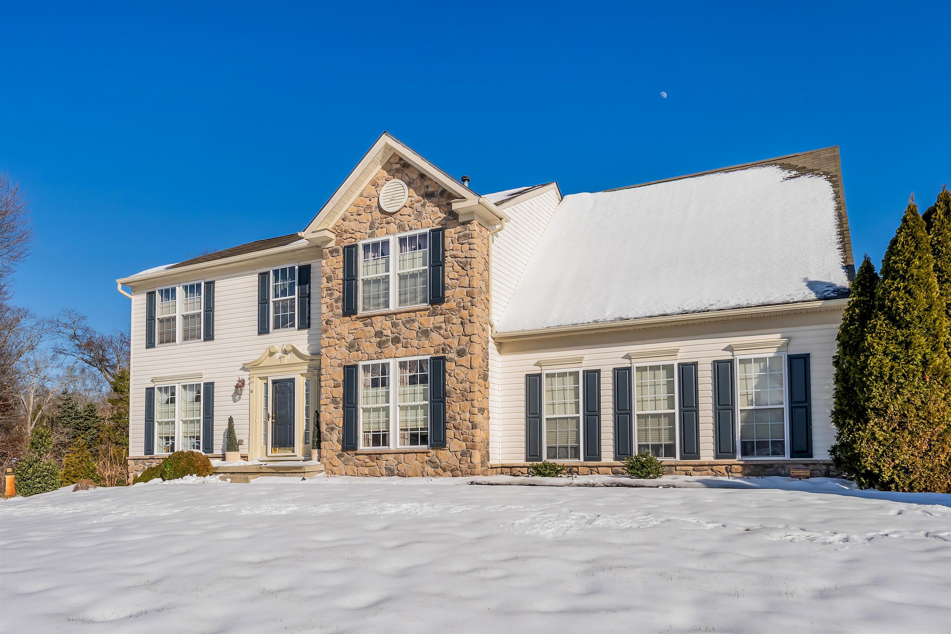 Turning off from Pennsylvania Ave and entering Meadow Valley Estates the setting transitions into a quiet, well-established community. This beautiful two story home, situated at the highest elevation within the estates features four-bedroom home, situated on a generous 1.2 acre lot. The property features a remarkable 90-foot double car driveway, offering parking for up to eight cars making it perfect for families with multiple vehicles or hosting gatherings. Plus an attached 2 car side entry garage measuring 24'x 21'. The curb appeal to this beautiful home is enhanced by partial stone veneer including a striking center front stone finish. Step inside to a welcoming foyer with a cathedral ceiling and 3/4 inch hardwood flooring, opens to formal dining room perfect for hosting family gathering and special occasions, a formal sitting room provides an elegant space for conversation or quiet relaxation. Additional living areas flow seamlessly, highlighted by a cozy living room featuring a gas fireplace with Blackstar polished granite surround, battery backup control with two accent dimmable lights above the mantle. The kitchen combines style and functionality with Rosewood colored granite countertops offering ample workspace and storage. Step out into a 12x35 composite rear deck which faces east so it's always in the shade by 2.30pm. The second Floor features four spacious bedrooms and two full bathrooms including a generously sized primary suite. The owner's suite measures 29'x17.5' and includes his & hers walk-in closets providing exceptional storage. the primary bathroom spans 18feet and is equipped with a Jacuzzi Whirlpool tub, a private toilet area, and a linen closet. The additional bedrooms are well proportioned and share a full hall bath, offering comfort and flexibility for family or guests.