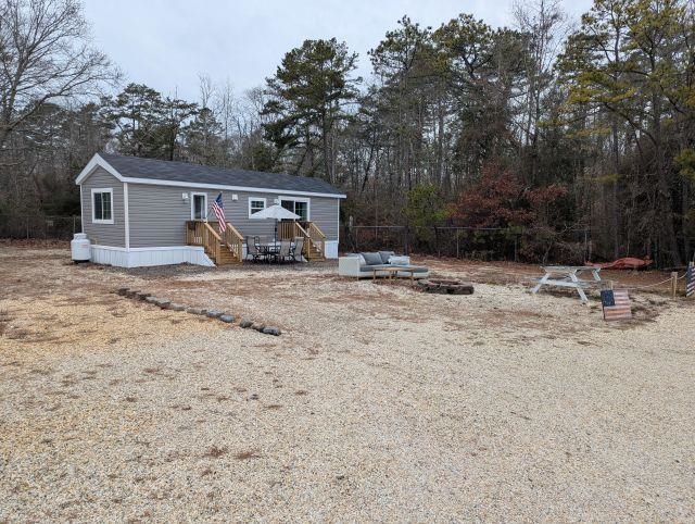 Fantastic unit located in Down the Shore seasonal park minutes to SIC & OC. This is one of the premier lots in the entire campground. This is the last site on the highly desirable lake front street. You will never have anyone on the one side of you and it looks like there is plenty of room to add an addition for yet even more interior space (buyer due diligence and permits needed) This unit is titled as a 2026 but was placed on the lot last year. 2 FULL bedrooms with lots of shaker style white built ins, huge shaker style storage area, ample size kitchen with SS appliances and a full size range with microwave above it. Great size bathroom, and lots of upgrades. Massive size rear yard too~ This unit comes with a golf cart & 2026 paid season ($9900) (with full price offer), kayak and little oar boat. This is a gated community with lots of planned family activities, pool, mini golf, food trucks on weekends and minutes to the beach!