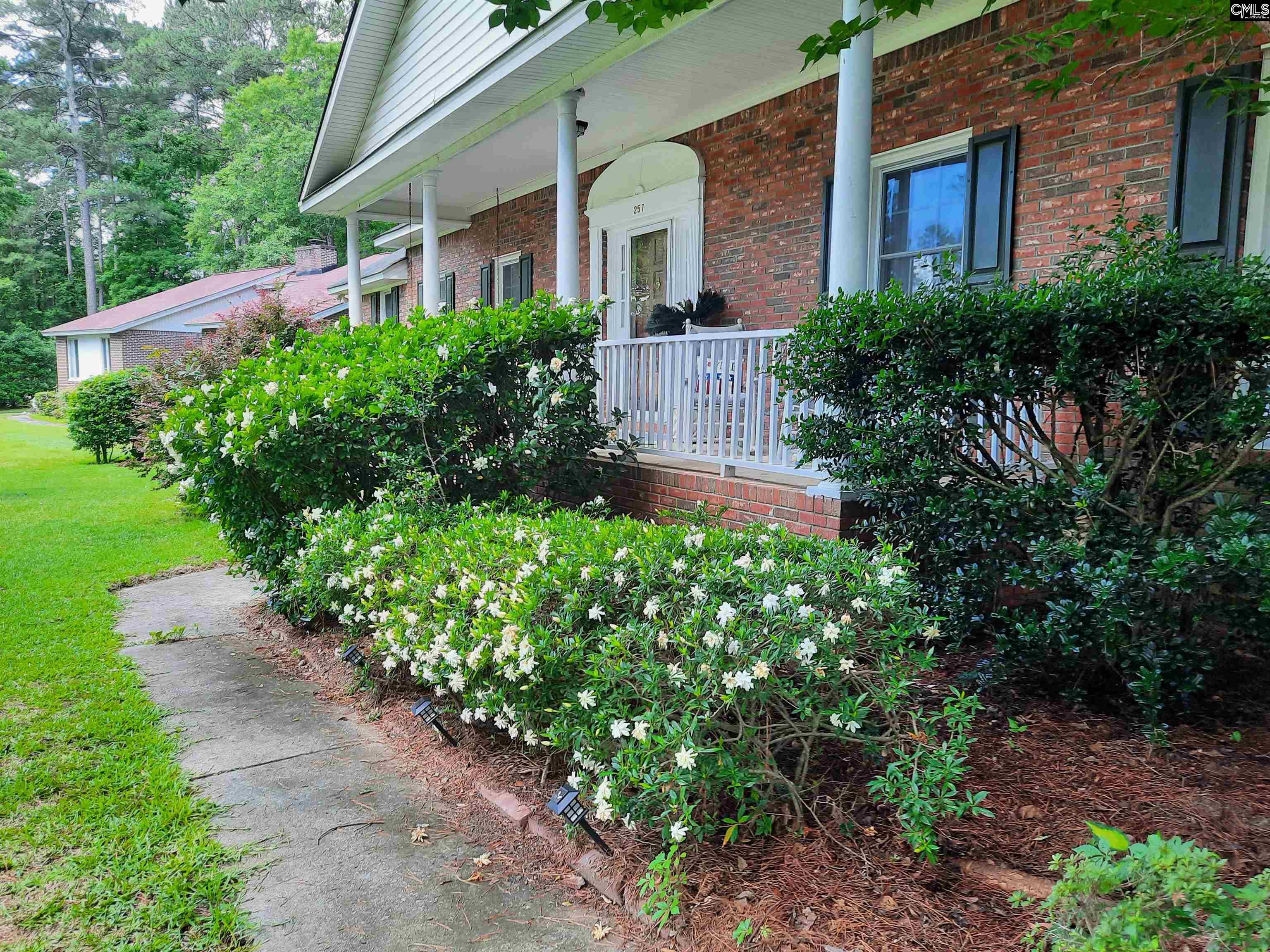 Up to $15,000 SELLER CREDIT Available toward closing costs or interest rate buy-downs!Welcome home to this spacious, single-story, all-brick residence nestled in the peaceful, GATED community of Spring Valley in Northeast Columbia. This well-maintained home is packed with recent upgrades, including a brand-new roof, energy-efficient 2-stage HVAC system with a smart thermostat, new water heater, and updated appliances. Step inside to find beautiful HARDWOOD FLOORS flowing through the living and dining rooms, creating a warm and inviting atmosphere. THE FAMILY ROOM IS A SHOWSTOPPER, featuring soaring cathedral ceilings, classic colonial maple wall paneling, and a stunning oversized brick fireplace—perfect for cozy evenings. Gather in the expansive eat-in kitchen, fully equipped with stainless steel appliances, a double oven, gas cooktop, granite countertops, abundant cabinetry, a large pantry, and a charming breakfast nook with its own brick fireplace.The primary suite offers a walk-in closet and a private ensuite bath with both a tub/shower combo and a separate step-in shower. Three additional bedrooms share a beautifully renovated hall bathroom, complete with an accessible, spa-inspired rain shower. Enjoy outdoor living at its finest in your own private retreat. Sip your morning coffee IN THE PORCH SWING on the covered front porch. Relax in the LIGHTED HOT TUB on the deck, or host gatherings in the large screened gazebo. Spring Valley residents enjoy the peace of mind of GATED ACCESS with 24/7 PRIVATE SECURITY, along with optional membership to the Spring Valley Country Club, offering golf, tennis, a swimming pool, and vibrant social events. Conveniently located near Ft. Jackson, major interstates, and just 15 minutes from downtown Columbia and the State Capitol—this home truly has it all.  Disclaimer:  CMLS has not reviewed and, therefore, does not endorse vendors who may appear in listings.