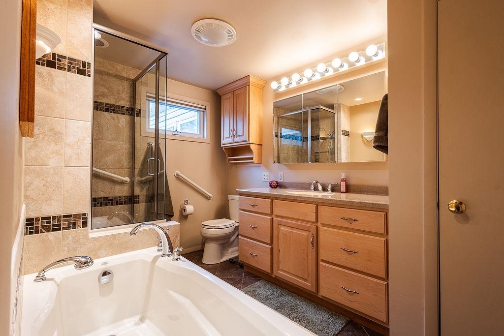 shared with upper bedrooms, access through primary bedroom and hallway
