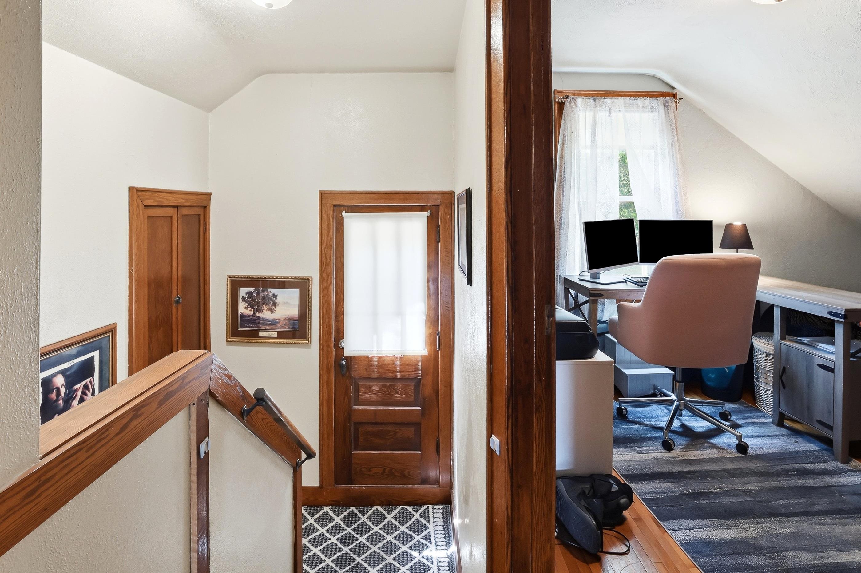 Upstairs in the hallway. Door is an emergency exist onto the roof of the mudroom.