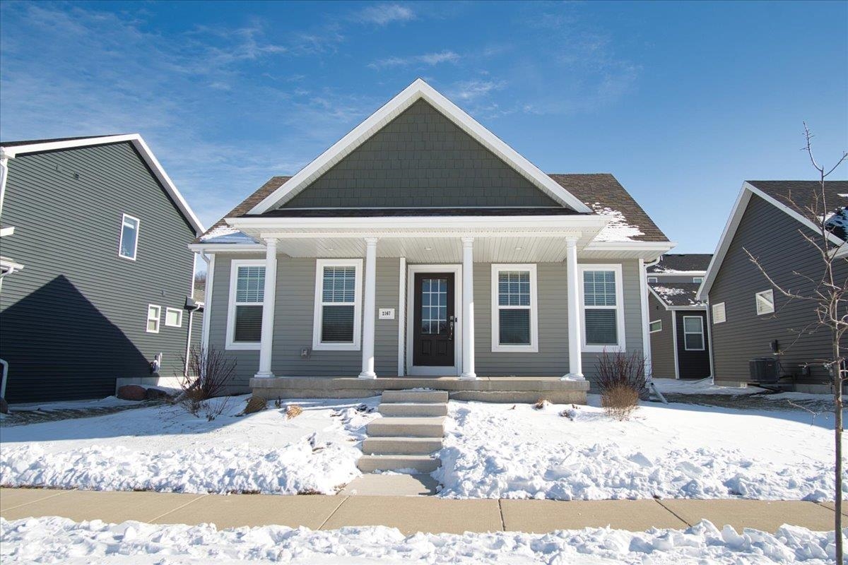 Enjoy scenic views of prairie, pond, and outlot green space right across the street from this beautiful home in the Village at Autumn Lake,  a new and highly desirable east Madison neighborhood. Step inside this inviting ranch to an open-concept layout where the living room flows seamlessly into the kitchen and dining area, ideal for everyday living and entertaining. The main level features three bedrooms and two full baths, including a spacious primary suite with walk-in closet and private ensuite. The unfinished basement offers endless potential for future expansion, storage, or recreation space. A wonderful opportunity to enjoy comfort, flexibility, and peaceful surroundings close to parks, trails, and east side amenities.