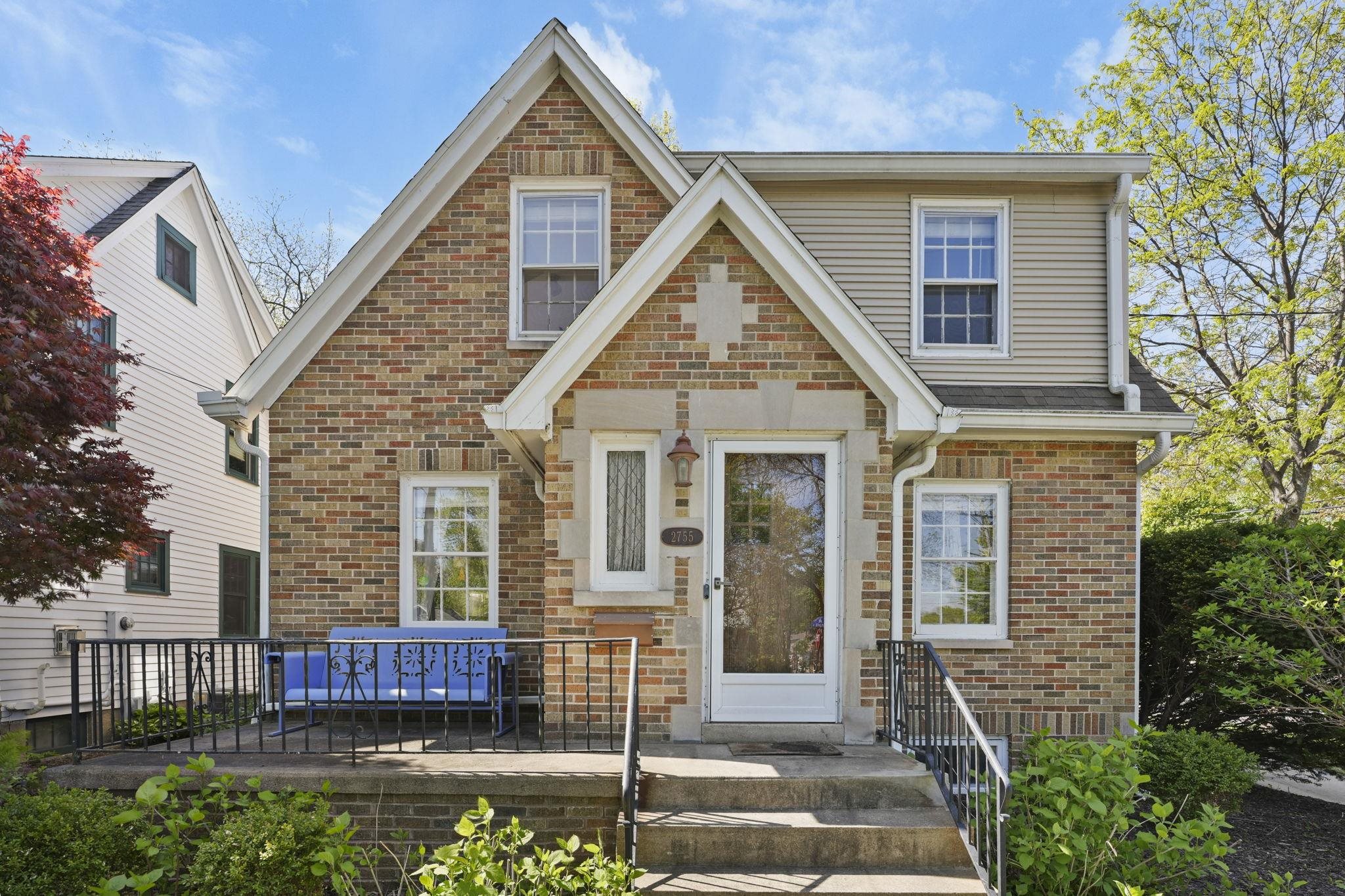 Charming brick home full of character & thoughtful updates on a coveted bicycle boulevard, ideally located near hospitals, campus, parks, & local favorites. Beautiful hardwood floors, bright living spaces, fresh paint, & a cozy wood-burning fireplace create warmth throughout the home. Nicely updated kitchen features stainless steel appliances & ample storage. Three oversized bedrooms include a spacious primary with walk-in closet. Stylish period tilework & a walk-in linen closet add charm & practicality to the bath. Large fully fenced yard offers an inviting & private entertaining space, plus a charming front porch.  The newly added sunroom/drop zone brings extra functionality & natural light. Rare attached garage fits a full-size vehicle with additional off-street parking. Dry basement offers potential for future finished living space & already includes a toilet for a future bath. Move-in ready with timeless appeal in an unbeatable location.