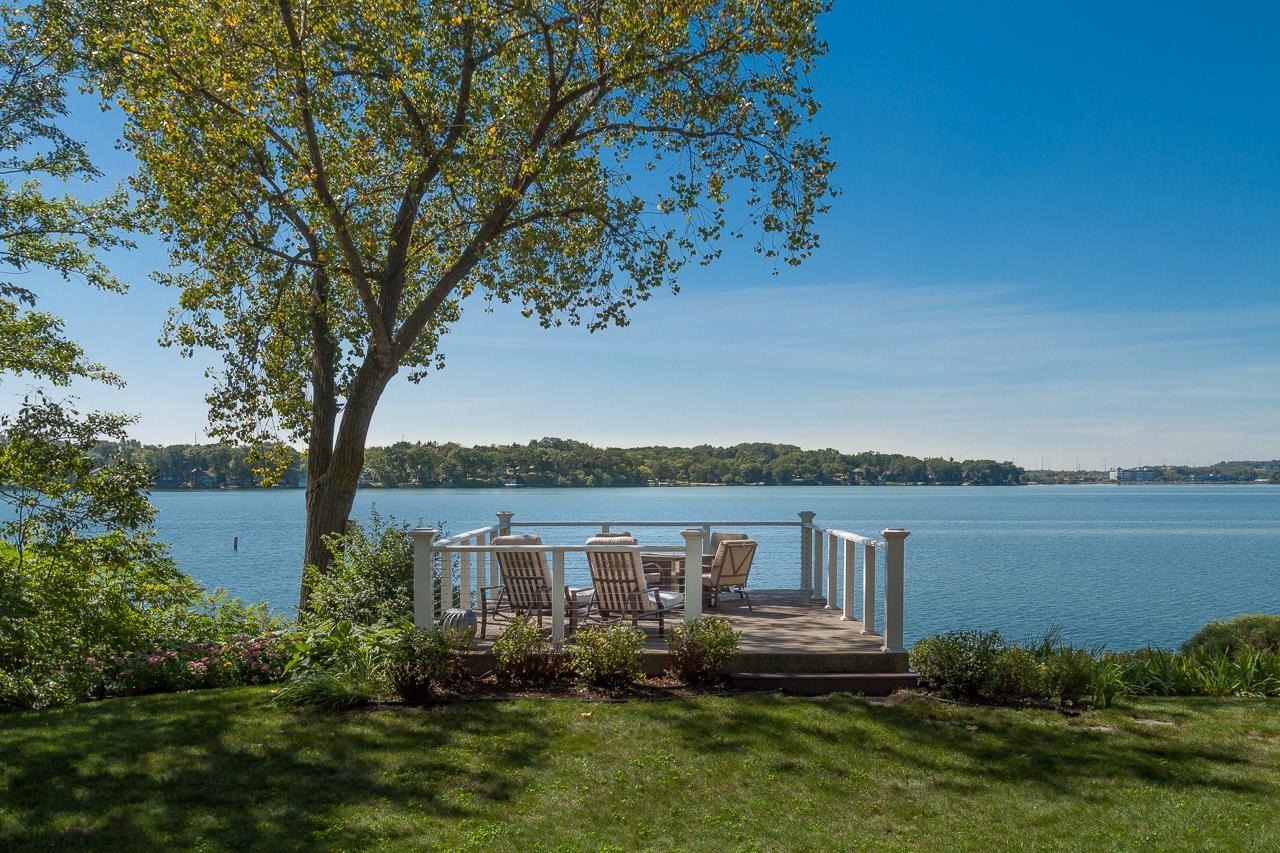 Rare Lake Monona opportunity in coveted Winnequah Point! This classic 2-story Colonial offers ~70 feet of frontage, a private boat house, ?+ beautiful lake ?& sunset views from one of Monona’s most desirable settings. The home features over 3,700 finished sq ft with 3 bedrooms, 3.5 baths, updated kitchen ?& bar, a fireplace? with custom built-ins, spacious main level living areas, ?& a lower level with rec room ?+ exercise space. The generous front and back yards provide exceptional outdoor space, with room to relax, entertain, garden, or enjoy lakefront living. Set on a deep corner lot this property offers a rare combination of privacy, usable yard space, and direct access to the water.  2026 updates include new roof, flooring, painting, entryway hardscapes, and more.  Bring your vision and make this special lakefront property your own!
