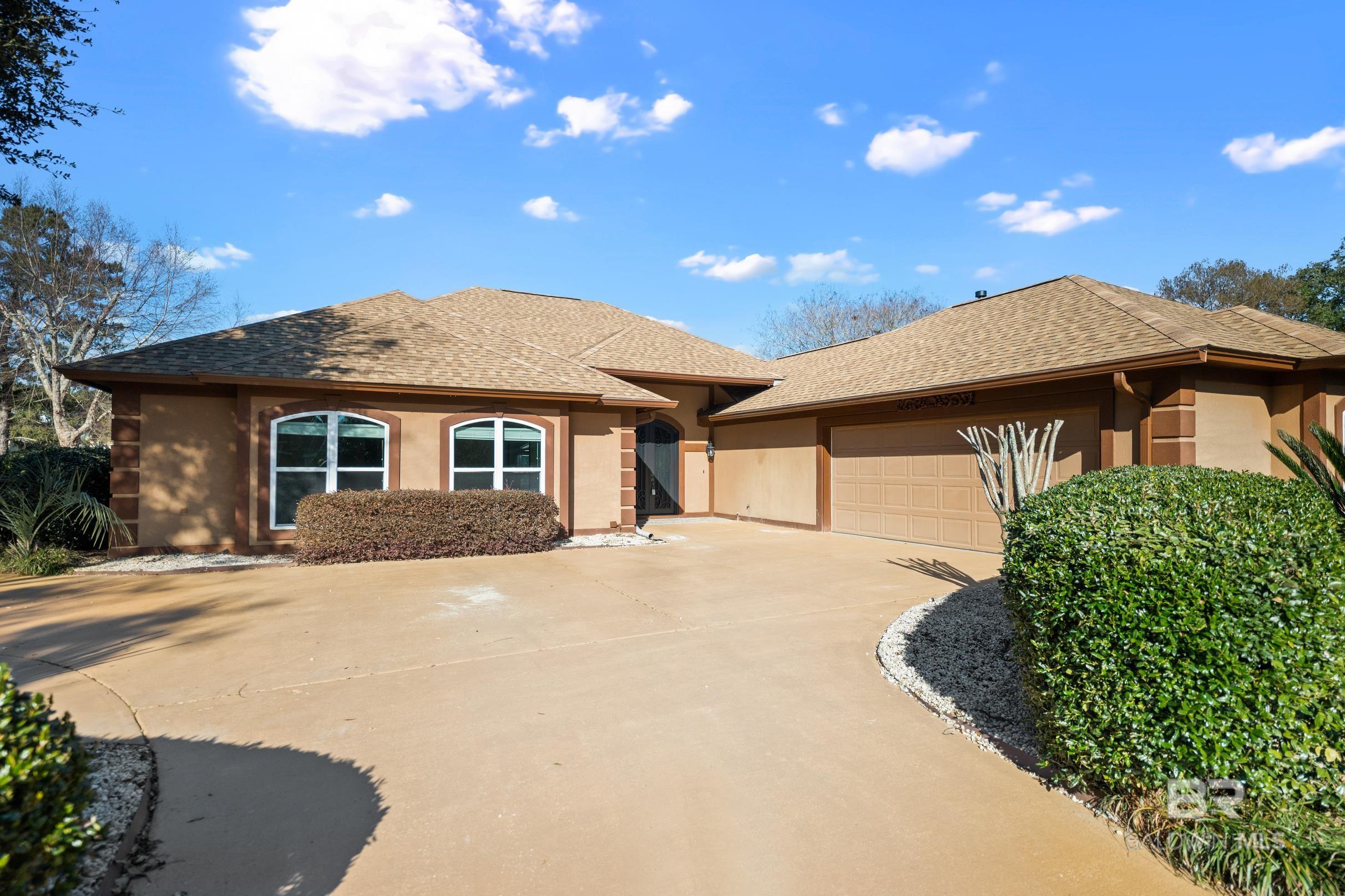 This updated 3-bedroom, 2.5-bath home in Craft Farms golf course community offers a water view and mature landscaping for privacy. Features include wood flooring, hurricane impact windows, iron front door, smooth ceilings, new HVAC (2019), roof (2013), and exterior paint (2020). The open-concept layout boasts a vaulted ceiling in family room, modern kitchen with granite counters, tile backsplash, and stainless appliances, and a bright breakfast area overlooking the lake. Separate office is adjacent to the kitchen.  The spacious primary bedroom has built-in cabinets, a large closet, and in-room laundry. Additional highlights are a 600sf screened porch with fountain & wall-mounted tv, irrigation system with private well, two-car garage and separate golf cart garage.  VA assumable loan under 3% for qualified buyers. Buyer to verify all information during due diligence.