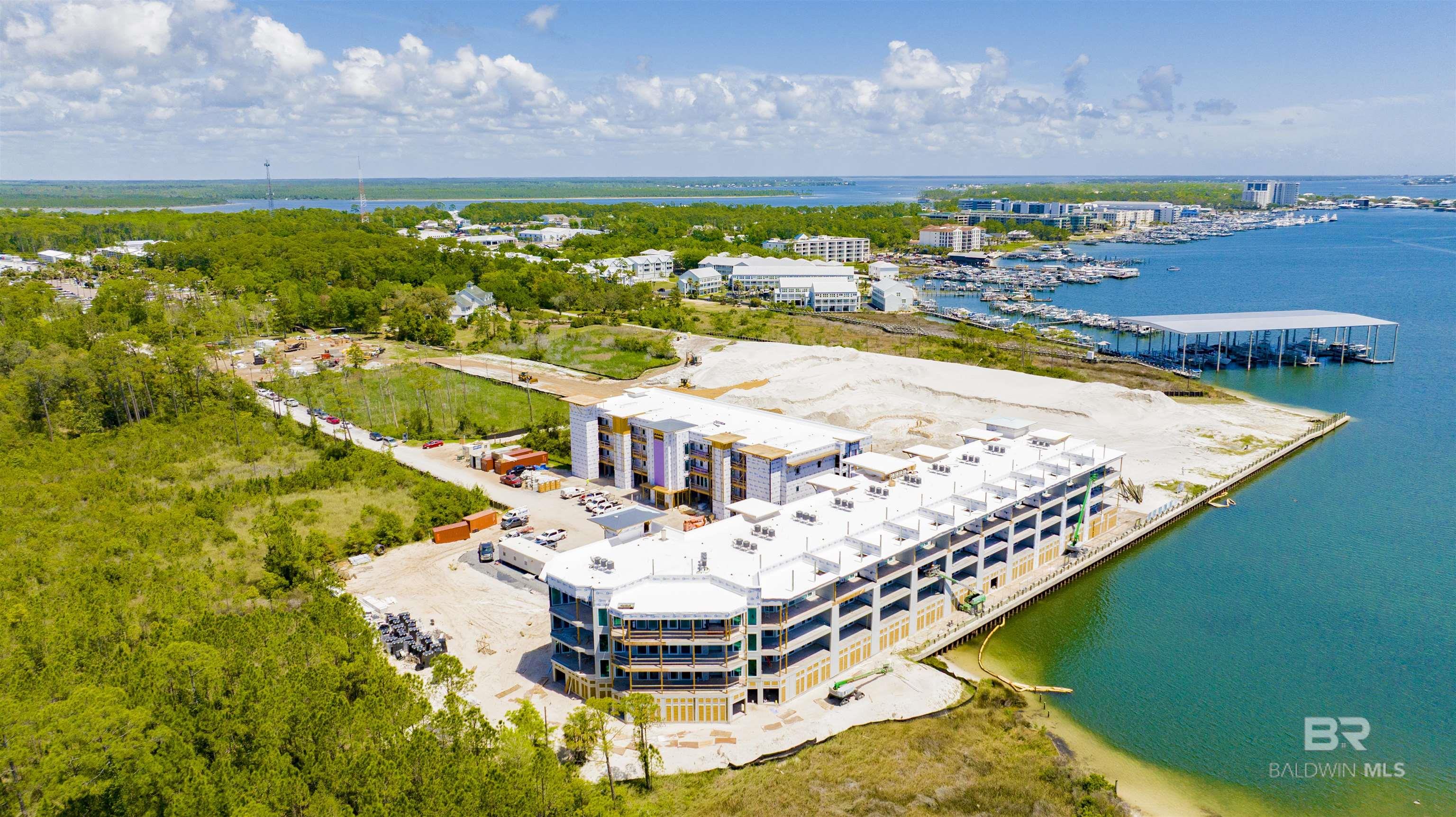 Pre-construction opportunity at Abaco Orange Beach! Overlooking the protected waters of Terry Cove, A103 offers a three-bedroom, three-bath residence thoughtfully designed for relaxed coastal living within Abaco’s marina-oriented setting. Open-concept living, dining, and kitchen areas flow seamlessly onto a covered balcony with gas grill, extending the interior space outdoors for effortless entertaining and everyday enjoyment. Finishes include engineered wood flooring, quartz countertops, solid-core doors, 9-foot ceilings, and a shiplap feature wall that adds subtle coastal texture. The kitchen is appointed with stainless steel appliances, gas stove, and a wet bar with icemaker. The primary suite features a tiled walk-in shower with glass enclosure, complemented by guest baths with tiled shower surrounds. Additional conveniences include a washer and dryer, dedicated owner storage, exterior storage, additional insulation for sound attenuation. Interiors are curated by Melanie Martin Interiors, reflecting refined coastal sophistication. Set within the gated Abaco Orange Beach community, spanning approximately 23 acres, residents will enjoy a full suite of amenities including a marina, resort pool with lazy river, waterfront greens, boardwalk seating, fitness center with sauna, pickleball courts, and additional outdoor spaces supporting both ownership and guest stays. A103 pairs a serene marina-facing perspective with full access to Abaco’s waterfront lifestyle. Completion anticipated late Summer, 2026! This is an equitable interest listing where seller is selling only an option contract or assigning an interest in a contract, such as a purchase and sale agreement or a contract for deed. In this situation, the seller does not have legal title to the property, but the equitable interest gives seller the right to acquire legal title. Buyer to verify all information during due diligence.