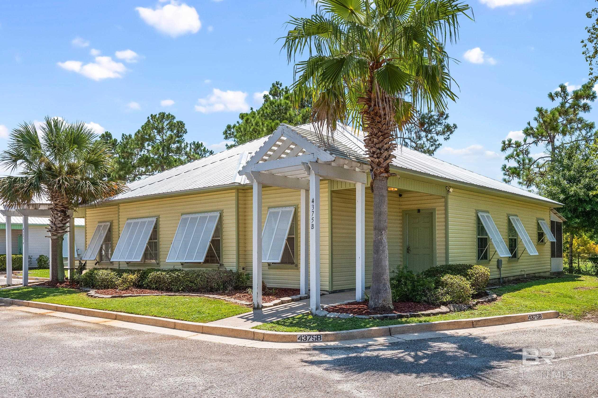 Welcome to Orange Beach Villas—an inviting coastal community tucked just off Canal Road in the heart of Orange Beach. This spacious 3-bedroom, 2-bath duplex-style home is adorably updated and full of charm, offering a bright, open layout that makes everyday living or vacationing a breeze. Step out back to enjoy the screened-in patio—perfect for relaxing after a day at the beach—and take advantage of the outdoor storage room for all your gear. The community features a refreshing pool and a welcoming clubhouse, ideal for homeowners looking to unwind or host intimate gatherings. Conveniently located near the Orange Beach Sportsplex, Gulf State Park trails, and The Wharf, this home offers easy access to some of the area’s best recreation, events, dining, and entertainment. Whether you're seeking a full-time residence, a second home, or an income-producing vacation rental, this property checks every box. Currently operating as a successful short-term rental, it's ready to enjoy or keep generating income. Don't miss this versatile opportunity in one of Orange Beach's most convenient and laid-back neighborhoods! Schedule your private showing today! Buyer to verify all information during due diligence.