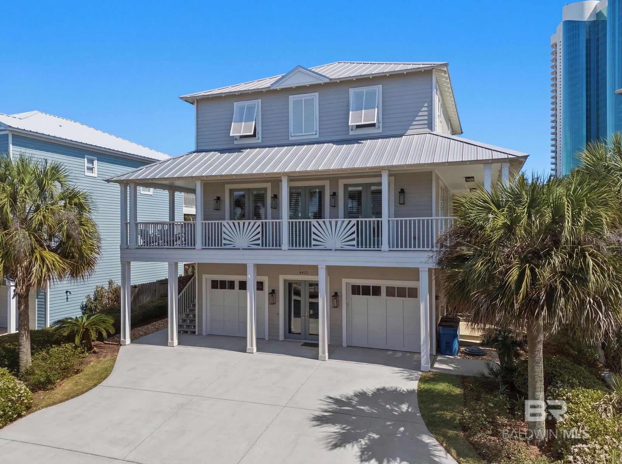 This beautiful custom built home located in the gated community of Palm Harbor with WATER VIEWS of the Gulf from the living area, three of the four bedrooms and from the wrap-around balcony.  As you enter the home you will notice the large FRENCH DOORS with an abundance of natural lighting.  The open staircase with custom steel stair frames and floating cypress stair treads with stainless cable rail system. This home has high in touches throughout.  The home has an open floor plan with a spacious living room and high ceilings. Lots of windows great lighting!  The dining area  has great flow through the kitchen and is perfect for entertaining!  You can enjoy the electric fireplace with a beautifully designed sinker cypress mantle.  The kitchen has floating shelves, stainless steal appliances, and waterfall granite plus plenty of drawers and storage.  You can also access the wrap around balcony from either the kitchen or 3 the French Doors off the living room where you can sit and enjoy the Gulf views.  The primary bathroom beautifully designed quartz shower with full glass enclosure and a rainfall showerhead with a Dual Electric Koehler shower system.   There are two vanities with oversized sinks and a hip door.  You will notice the custom built shelves from the floor to the ceiling lots of storage and extra space.  The primary bedroom has stunning water views right from your bed along with a wine cooler great for any occasion.  Each full bathroom has tiled showers with custom sliding glass doors.  This home can easily sleep 11 people with two king beds in both primary bedrooms and ample amount of space in the bunk beds room plus the additional bedroom. There is a DEEDED BOAT SLIP N 18. Plus the 2 car garage with walk in storage closets to keep all your beach toys.  The home really lights up at night with the low voltage LED on the Palm Trees.  This community offers deed beach access across the street. This home has it all call today to book your showing!  Buyer to v