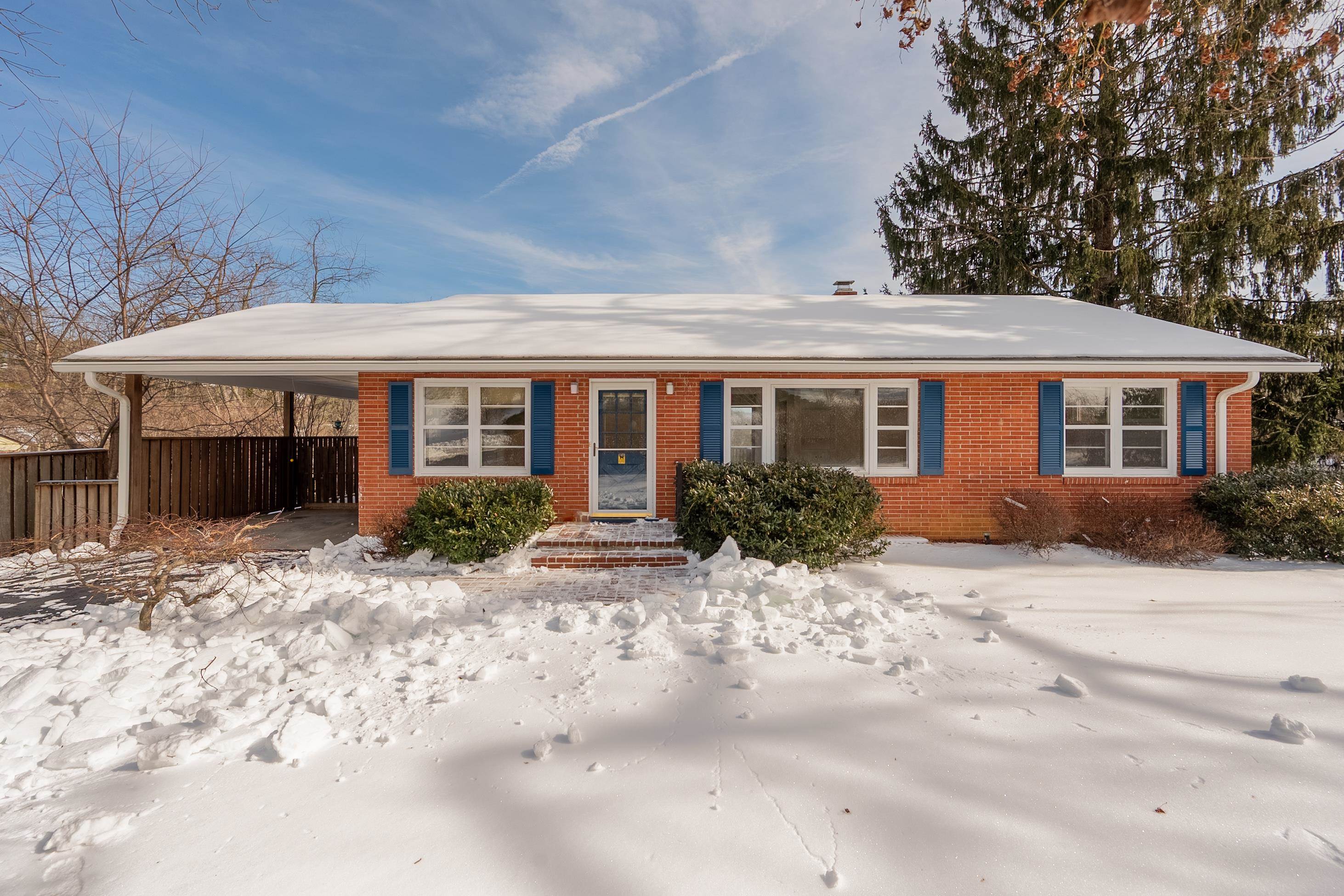 Enjoy main-level living and room to grow in this lovingly maintained Highland Park home with beautiful mountain views. Newly painted, the main level features hardwood floors, an updated kitchen with brand-new fridge, views from the deck and atrium dining room windows, large living room, office/optional extra bedroom, 2 bedrooms and laundry in the hall bathroom. The walk-out basement has 2 additional bedrooms, a large family room with built-ins, laundry room with utility sink, full bath and 2 additional storage rooms.  Outside features include a fully fenced back yard, single carport, redwood deck with retractable awning and beautiful landscaping. Schedule a tour today!