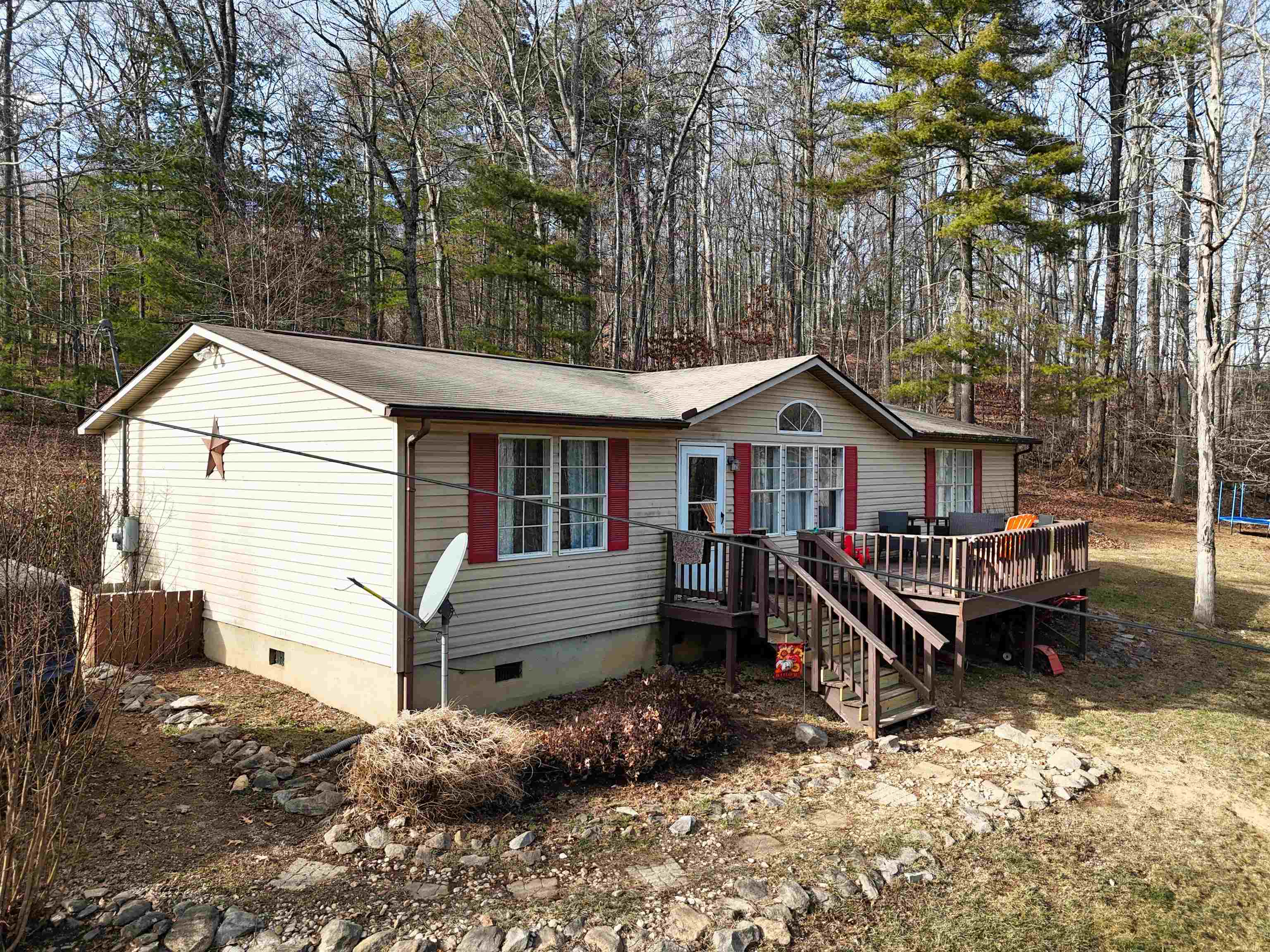 One-level home featuring three bedrooms and two baths in the desirable Auburn School District. Enjoy a peaceful country setting while staying just 15 minutes from Riner, downtown Christiansburg, and I-81. The home offers vaulted ceilings, a spacious living room, and an eat-in kitchen, along with a front deck overlooking a level yard. Mature trees surround the property, providing privacy and cool summer shade. Move-in ready! Call today to schedule your private showing!