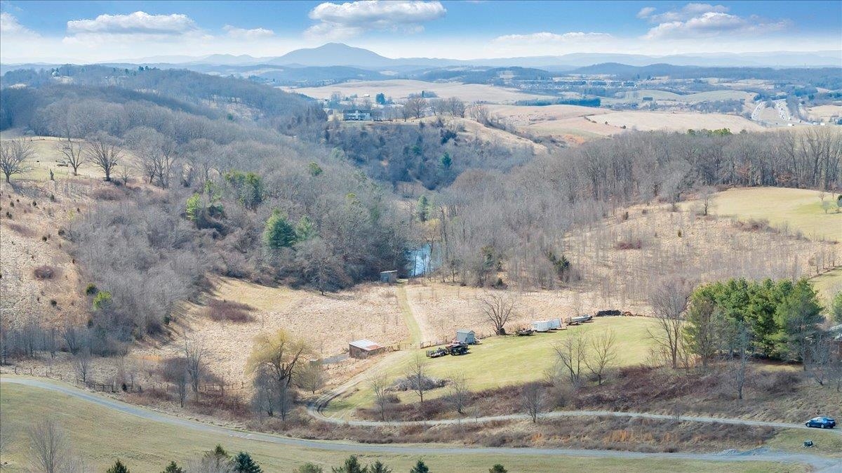 25 Breathtaking acres in Montgomery County, located in Auburn School District. Minutes from town conveniences yet peacefully tucked away for ultimate privacy. This fully fenced property offers open pasture ideal for horses, cattle or hobby farming with a fully stocked pond fed by a gentle stream. Woods rich with wildlife provide natural beauty and recreation, while elevated building sites capture stunning mountain views. Whether you're dreaming of a working farm, private retreat or a custom home with panoramic scenery, this property delivers the perfect blend of usability, serenity and location. Rare acreage with views, water, pasture and proximity, don't miss it! Schedule your showing today!