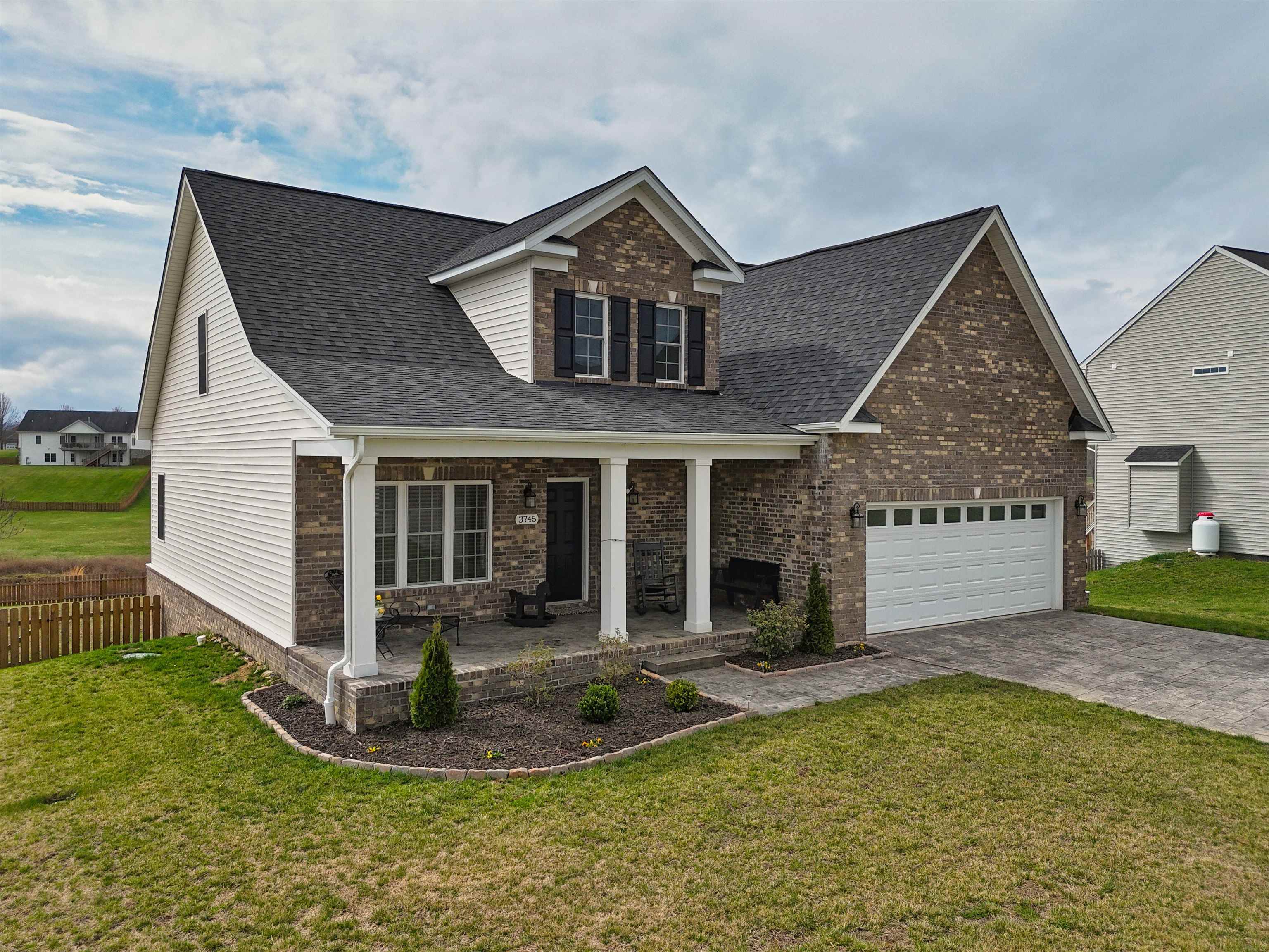 Welcome to this beautiful home in the Auburn School District that is better than new and move-in ready! The open floor plan features solid oak hardwood flooring throughout the main living areas, including the main-level primary bedroom, with ceramic tile in the baths and laundry and oak stair treads leading to the second floor. The primary bathroom offers a tiled shower, deep soaking tub, and double sinks with a granite vanity top, with the convenience of main-level laundry. The kitchen includes a large bar area with granite countertops and a pantry for extra storage. The formal dining room is enhanced with crown molding, chair rail, and wainscoting. Enjoy the flat, fenced backyard from the rear deck that is perfect for pets, play, or entertaining with a great mountain view. The full walkout basement is plumbed for an additional full bath offering excellent expansion potential with a concrete patio. Call for your private showing today!