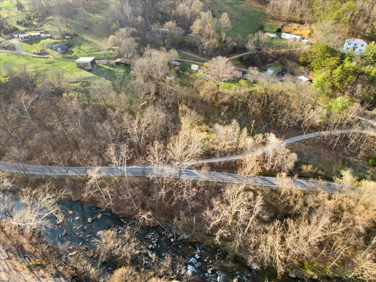 Looking for affordable land just outside of town? This 0.7-acre parcel on North Fork Road sits only a few miles from Blacksburg and offers beautiful river views. It’s a perfect spot for a tiny home, featuring a flat, buildable area where an original cabin once stood. Schedule a tour today and come see the possibilities for yourself.