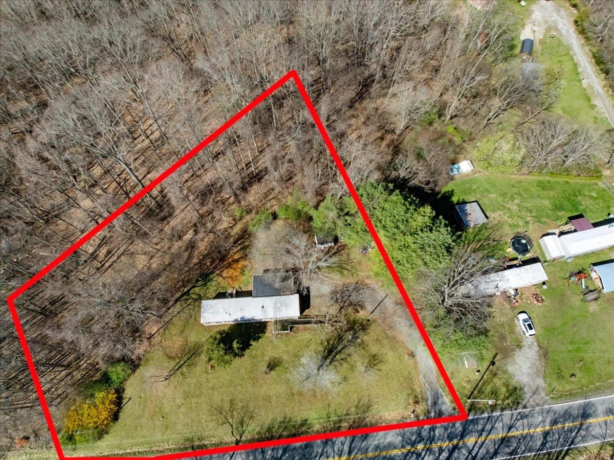 .88 Acres, well and septic (septic inspection attached) to convey AS IS,  trailer to convey AS IS, Blacksburg Schools, partially wooded-partially flat lot. Conveniently located close to Radford or Blacksburg.  Buyer and Buyers agent to verify all information.