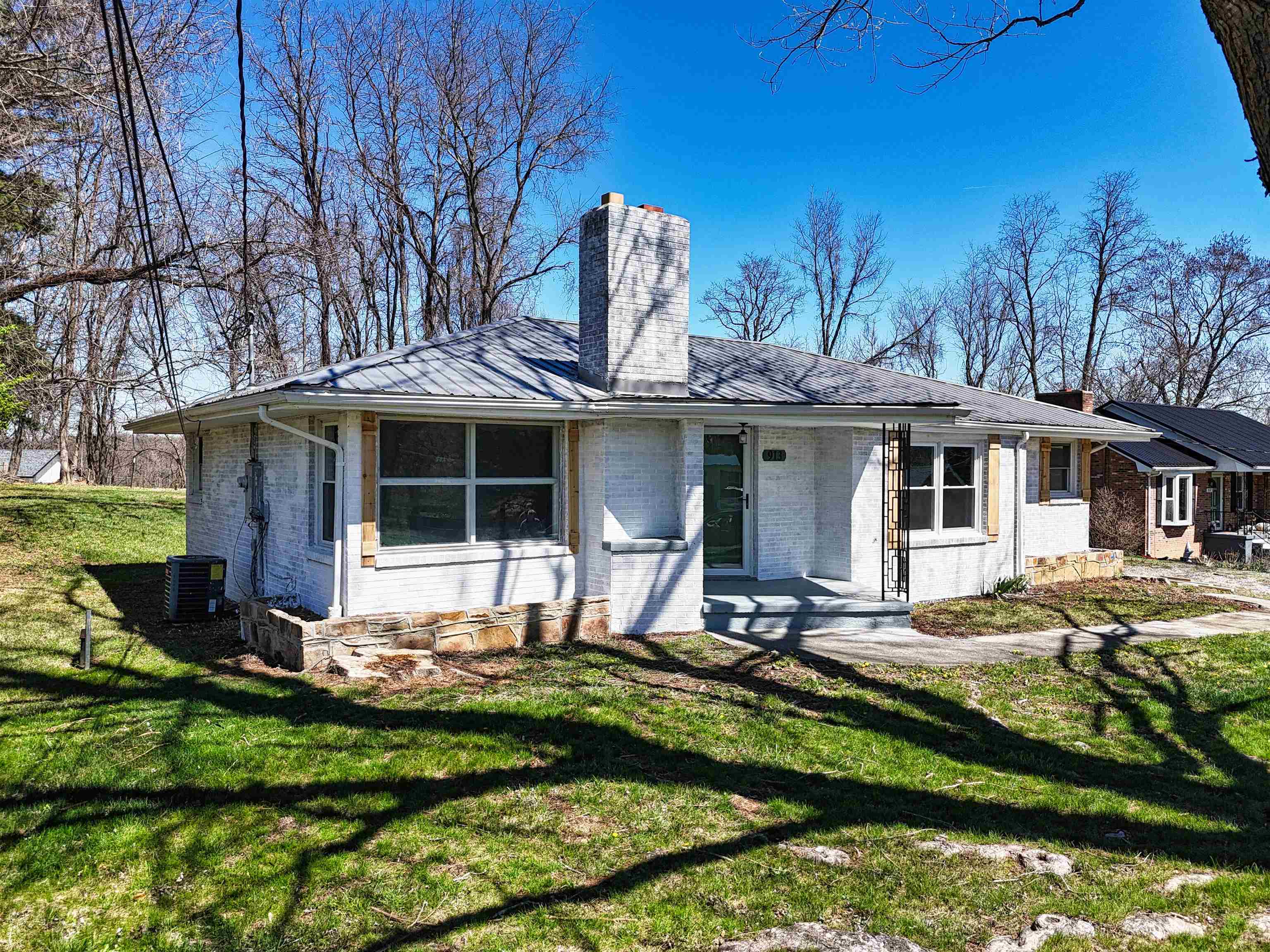 Beautifully updated three-bedroom brick ranch situated on two parcels and just minutes from I-81, downtown Pulaski, Lewis Gale Hospital, Volvo and shopping. This charming home features stylish light fixtures throughout, a picture window in the living room, and an abundance of storage or expansion potential in the unfinished walk-out basement. The kitchen and bathroom have been tastefully updated, with the kitchen offering stainless steel appliances—including a downdraft stove—and butcher block countertops. The basement is partially framed and includes a bathroom with a shower already in place. Enjoy a flat backyard with plenty of room to play. A deep one-car garage adds convenience and functionality.  Make your appointment today to view this treasured home!