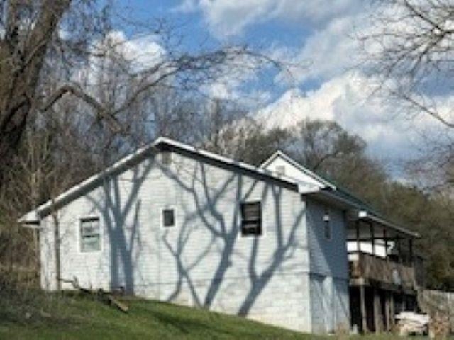 Bring your vision to this property that is full of opportunity! Previously used as a rental, this home sits on a peaceful lot and offers a solid starting point for renovation or investment. Significant updates will be needed, making it ideal for investors or buyers looking for a project!  This home has great potential to become a quiet country retreat or income-producing property, don't miss this opportunity to make it your own!
