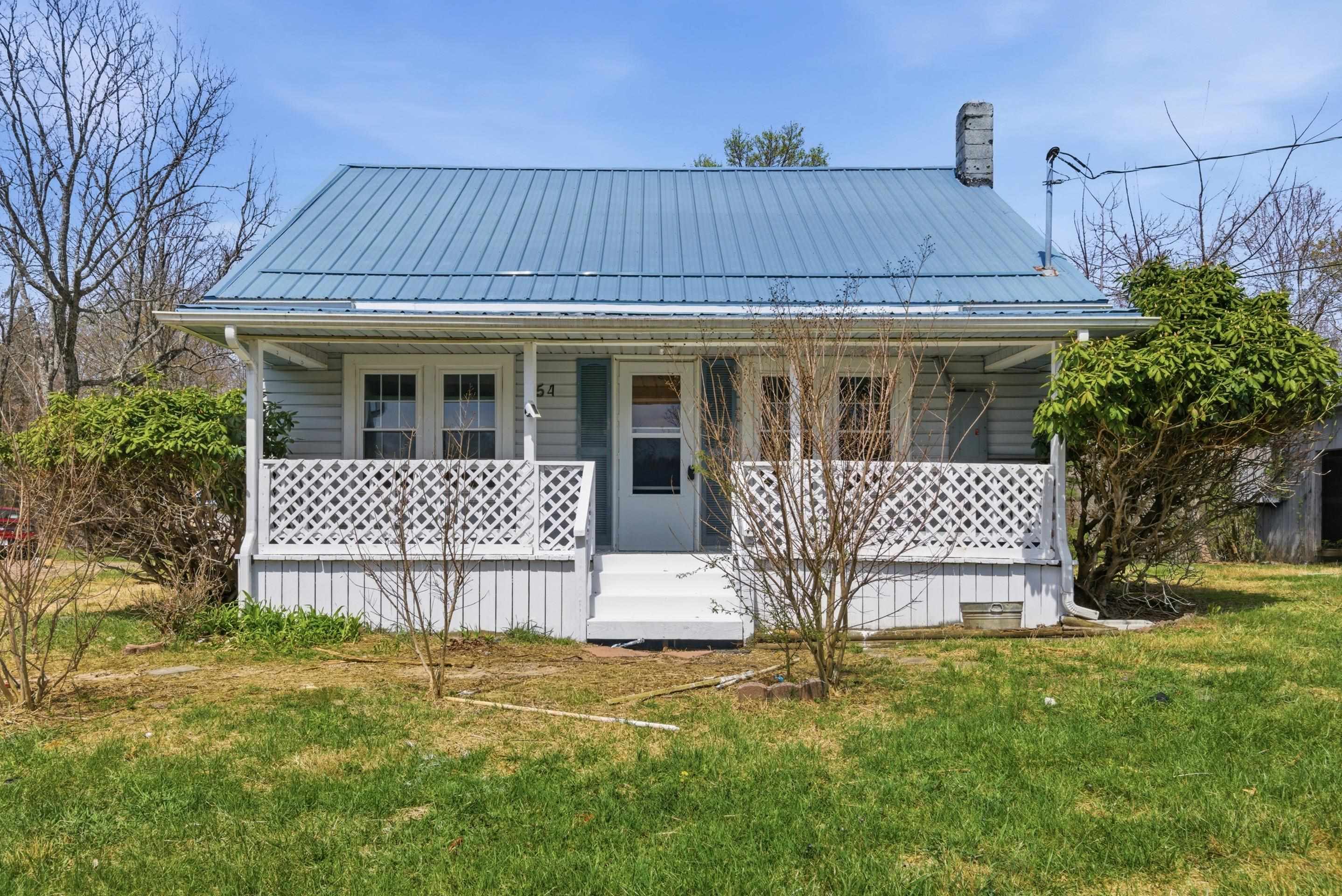 If you’re looking for space, privacy, and potential, this property in Galax is full of opportunity. Situated on over 8 acres within the city limits, this 2-bedroom, 1-bath home (with potential for a 3rd bedroom) is ready for your vision and personal touch. Having acreage is a rare find in the city and opens the door to a variety of uses—including the possibility of creating your own mini farm, with room for gardens, animals, and outdoor living.